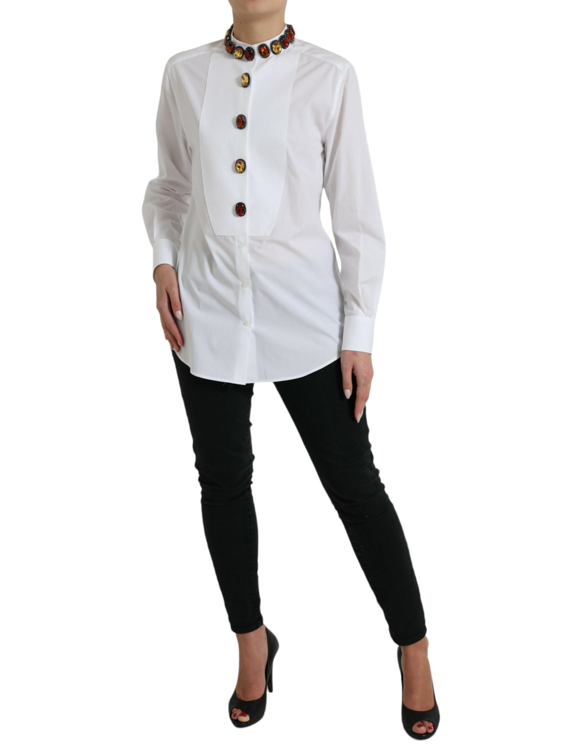 Woman wearing white shirt with black pants and heels