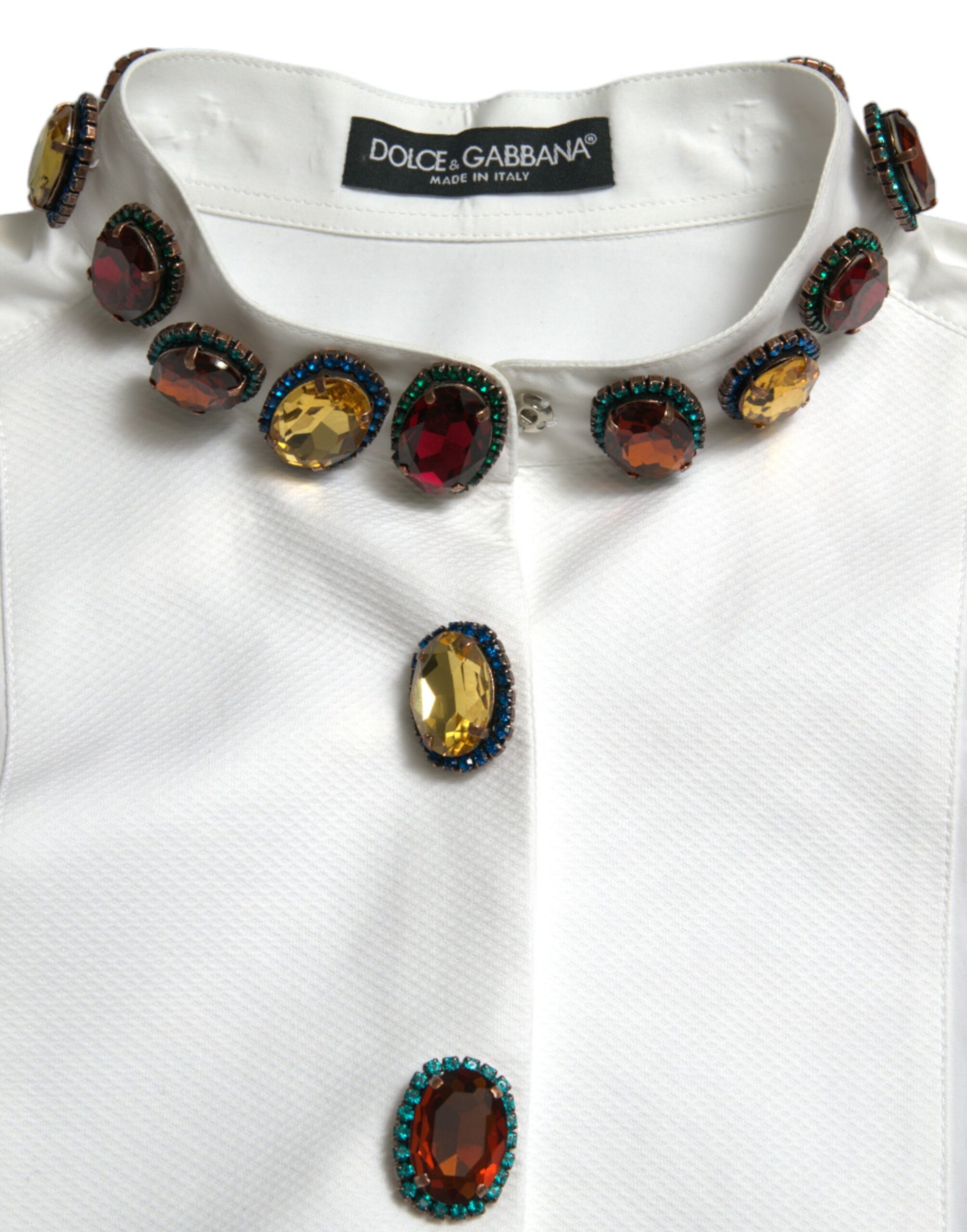 White shirt with a necklace featuring multiple gemstones