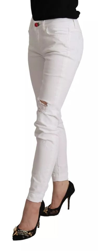 Woman wearing white pants and black shoes