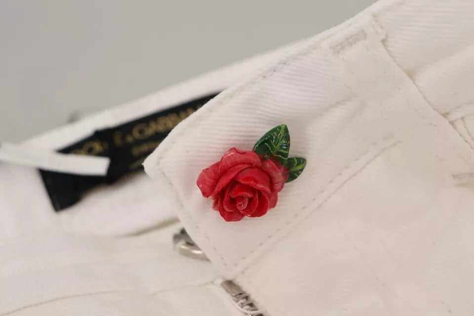 Red rose lapel pin on white fabric