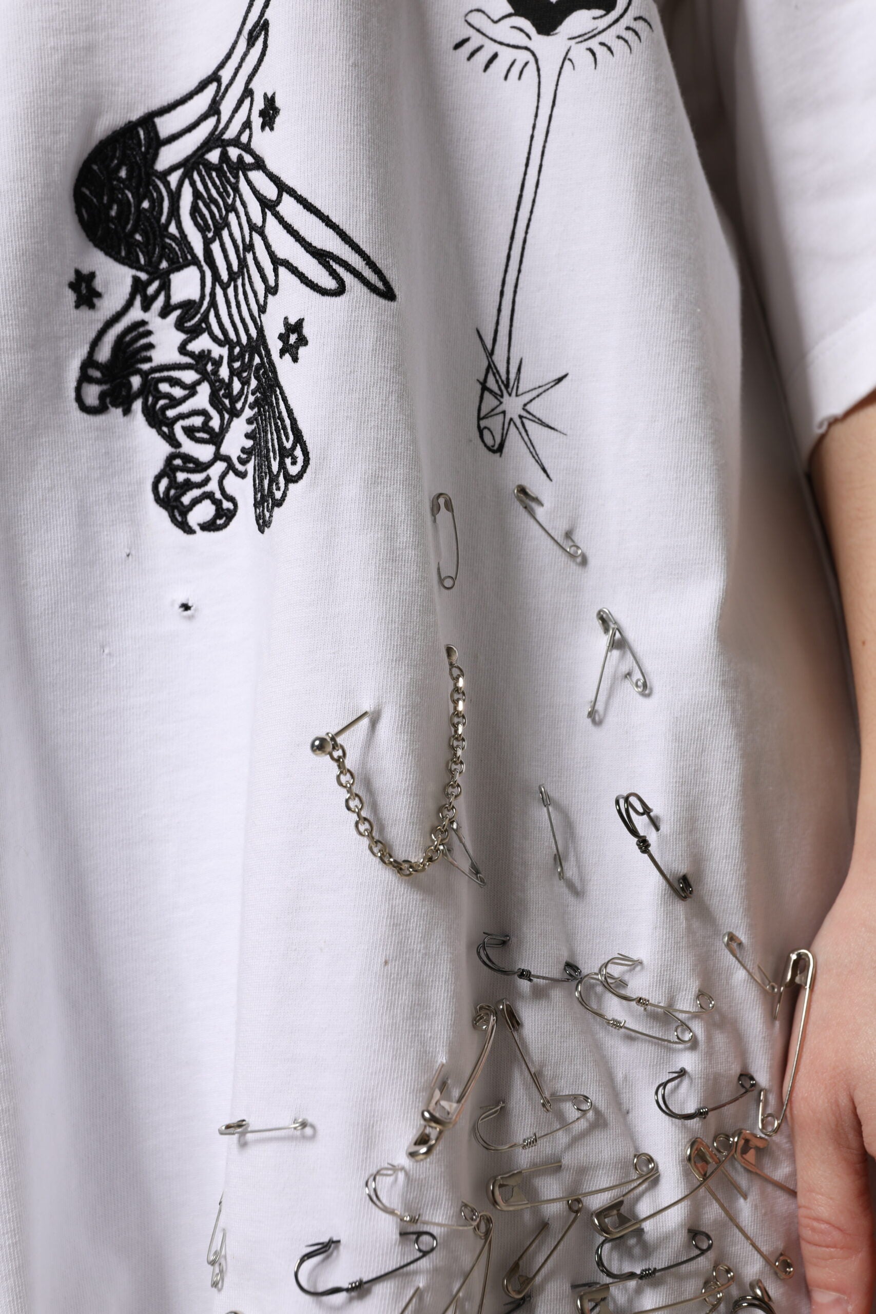 White towel with black design featuring a bird and stars