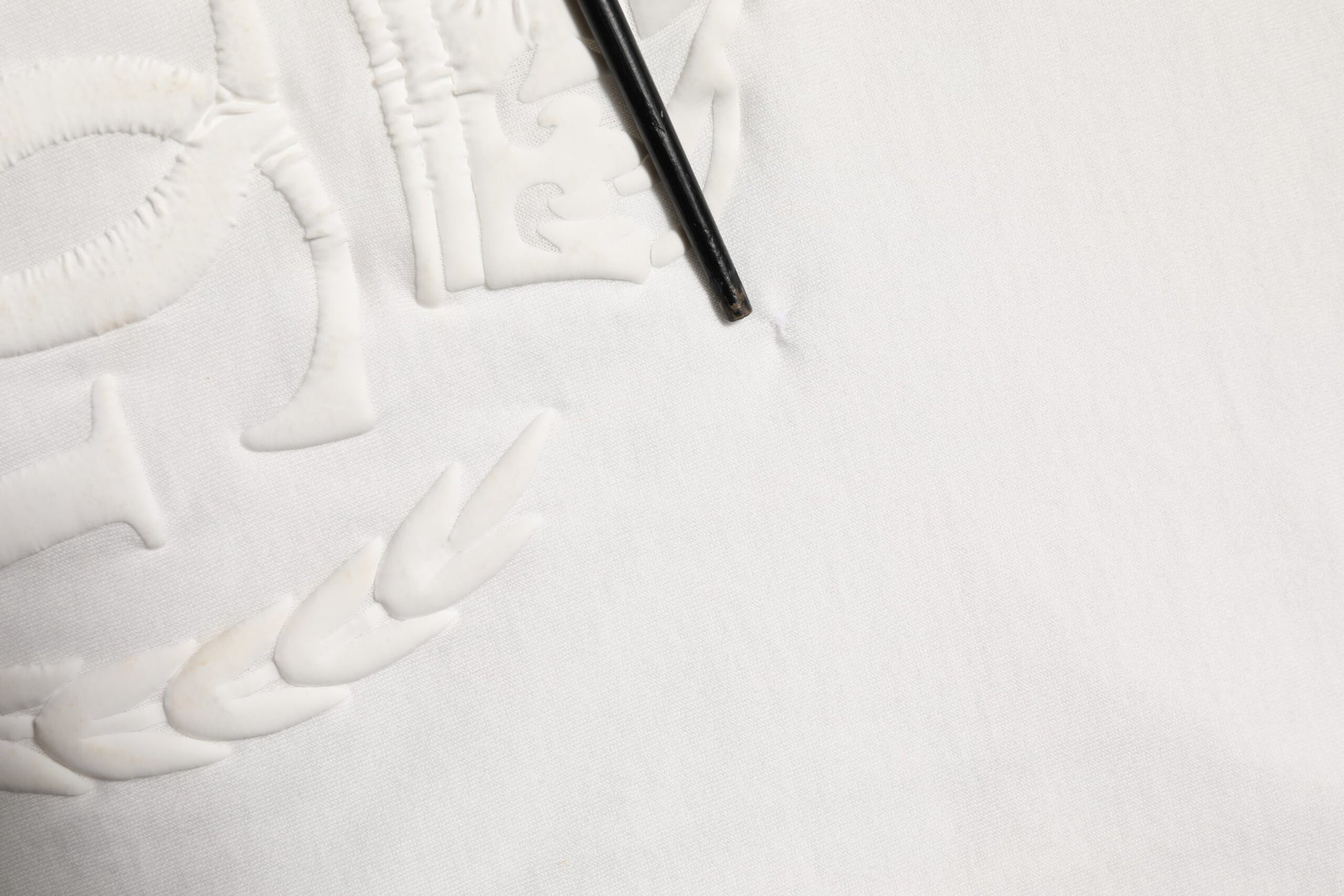 Handcrafted white towel with embroidered design
