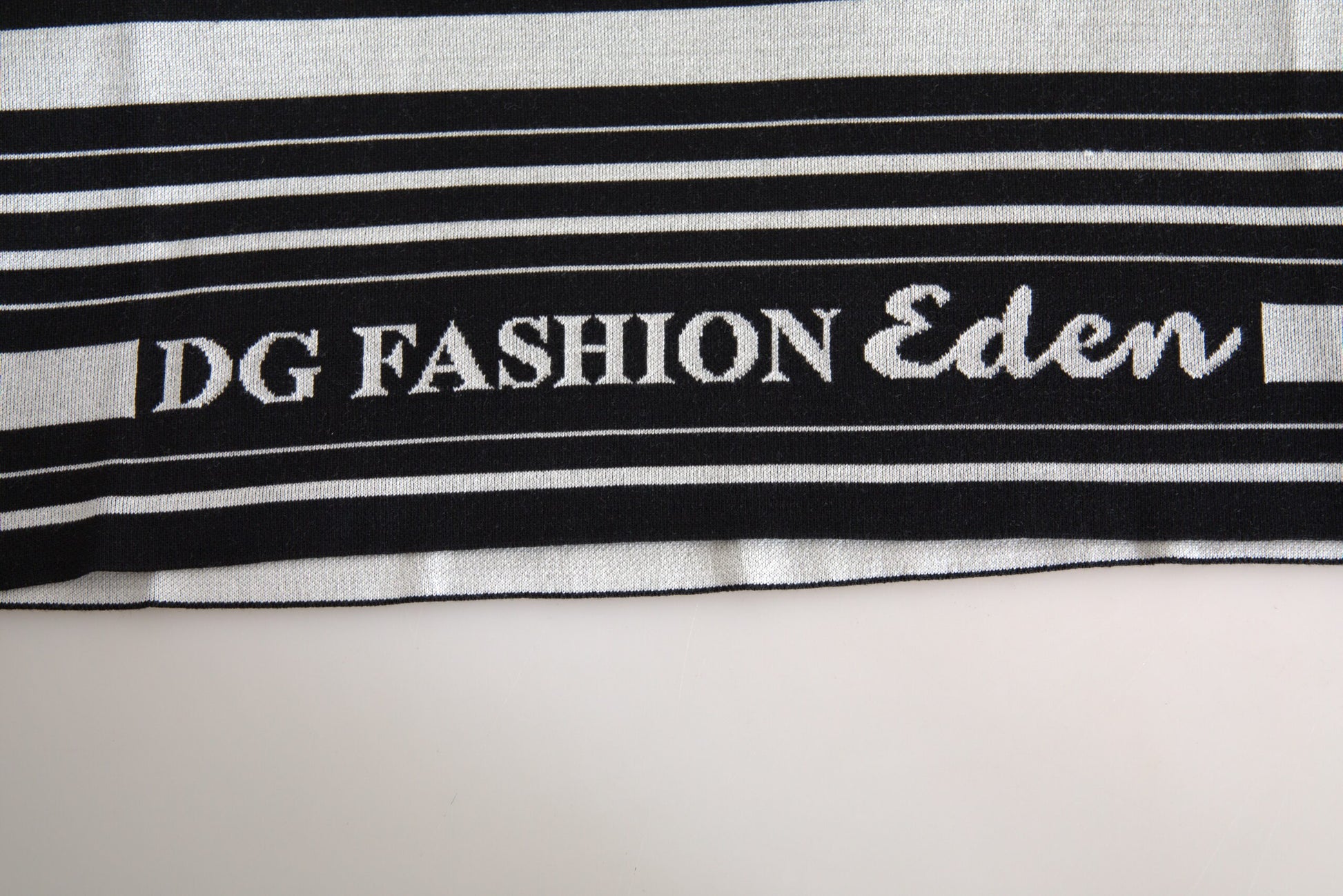 Black towel with white stripes and embroidered logo