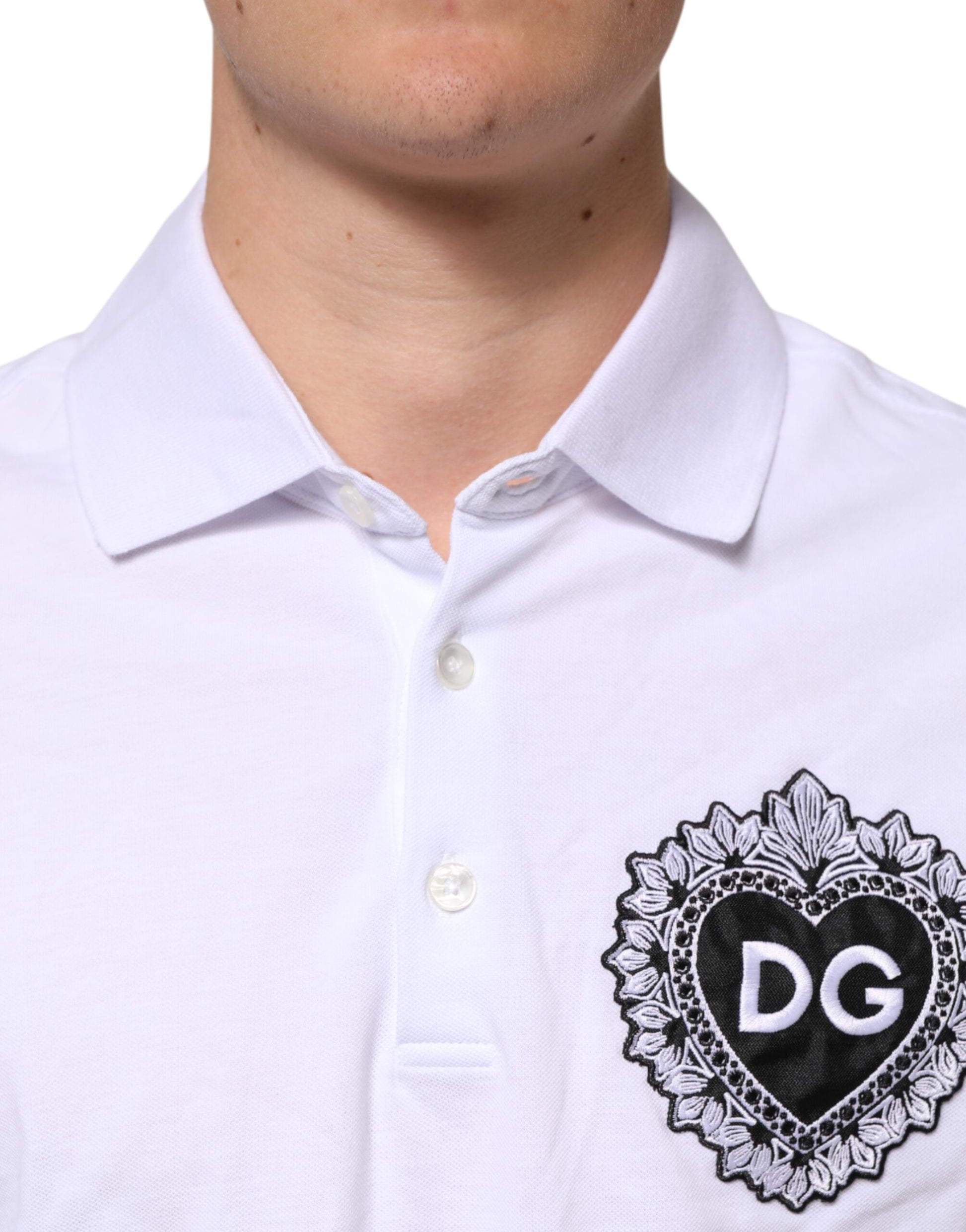 White polo shirt with black collar and heart design on left chest
