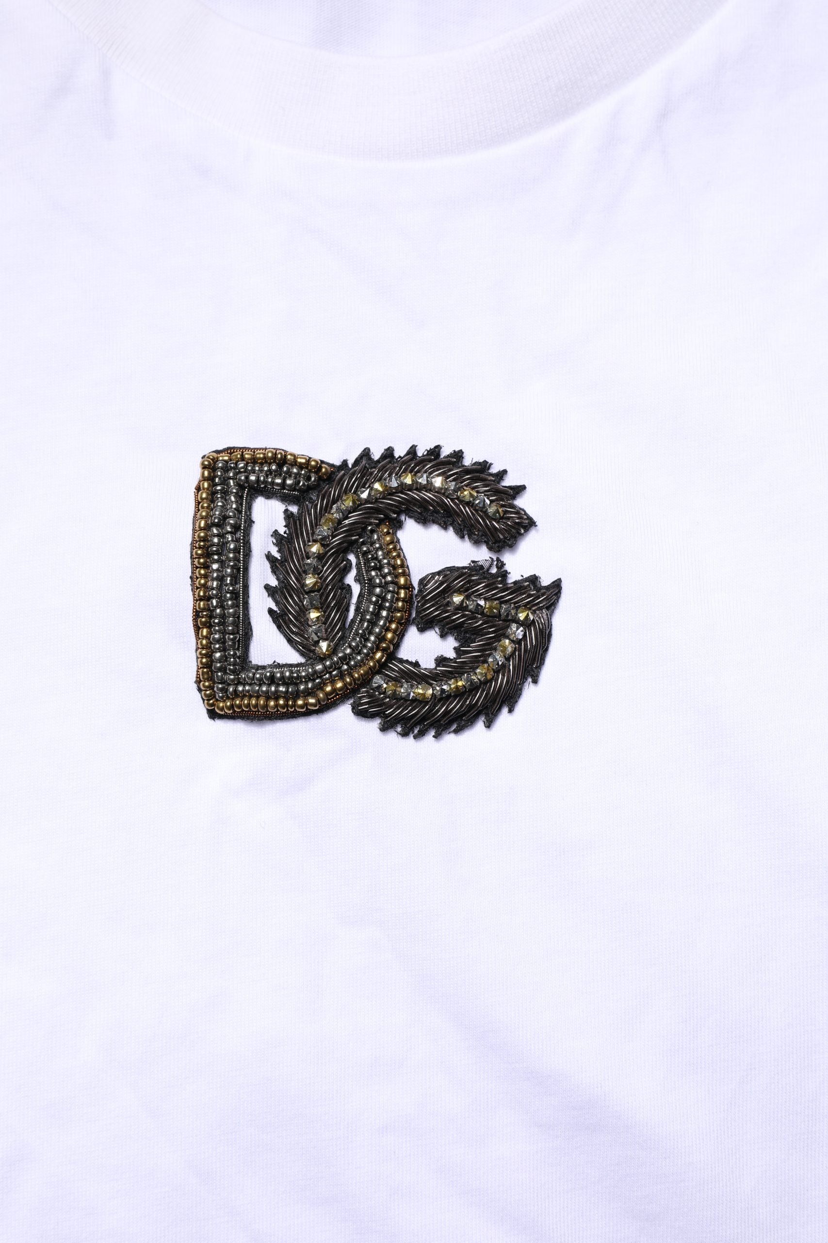Embroidered logo on white fabric