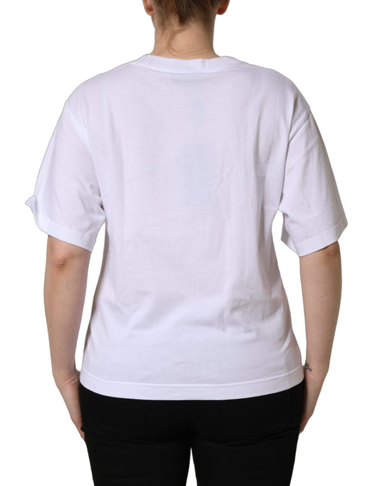 A white cotton t-shirt with a crew neck and a logo patch on the chest