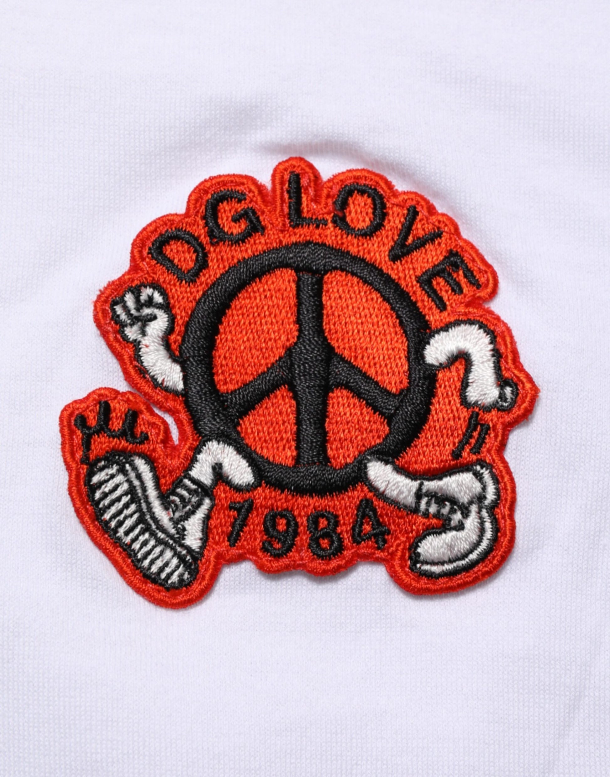Red embroidered patch on white fabric