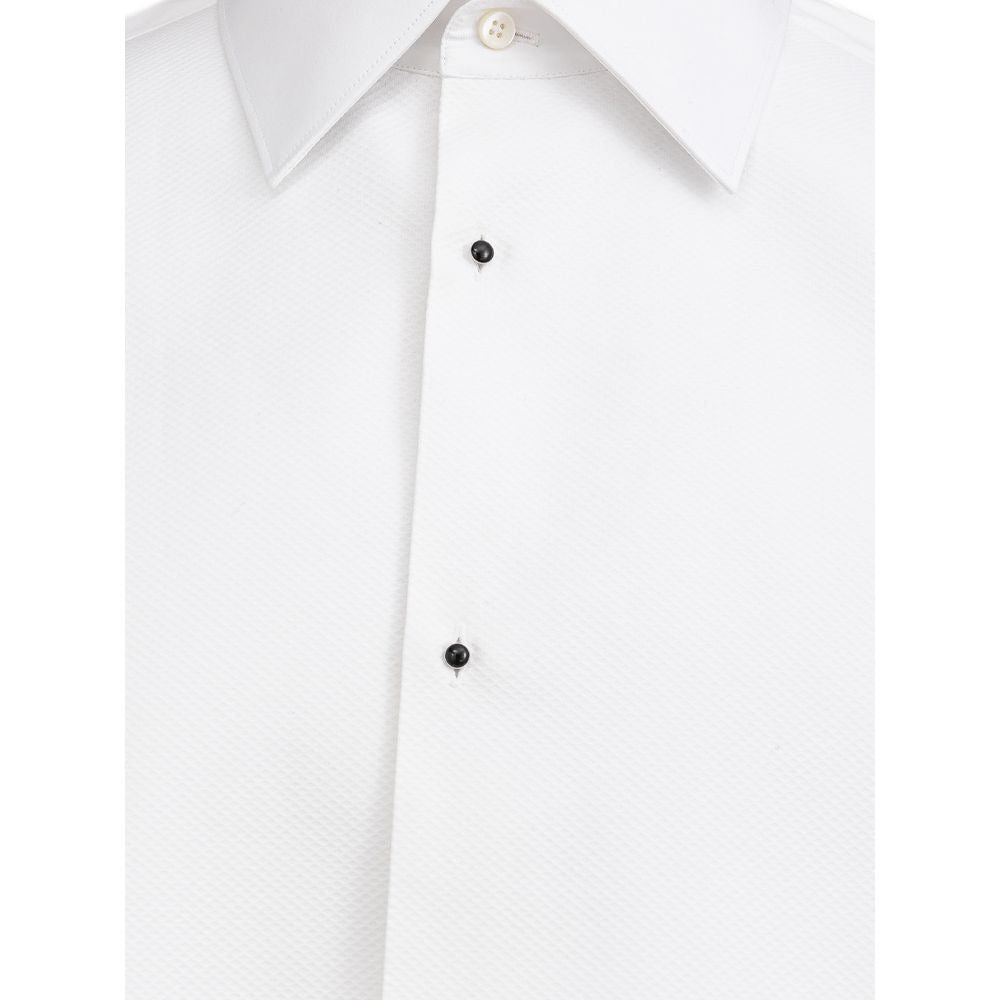 A white cotton dress shirt with a black button on the left side of the chest