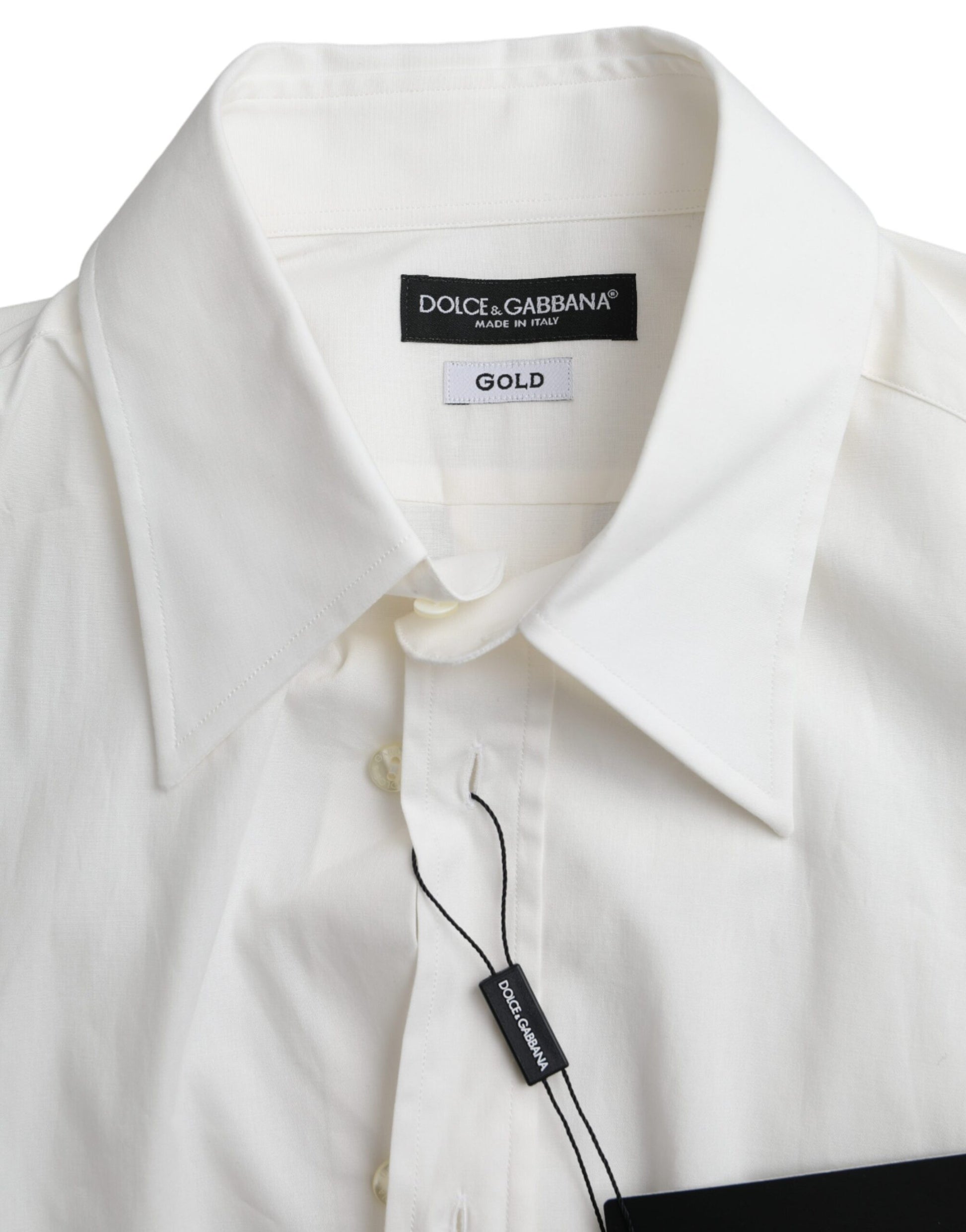 A white cotton dress shirt with a slim fit and gold label from Dolce & Gabbana