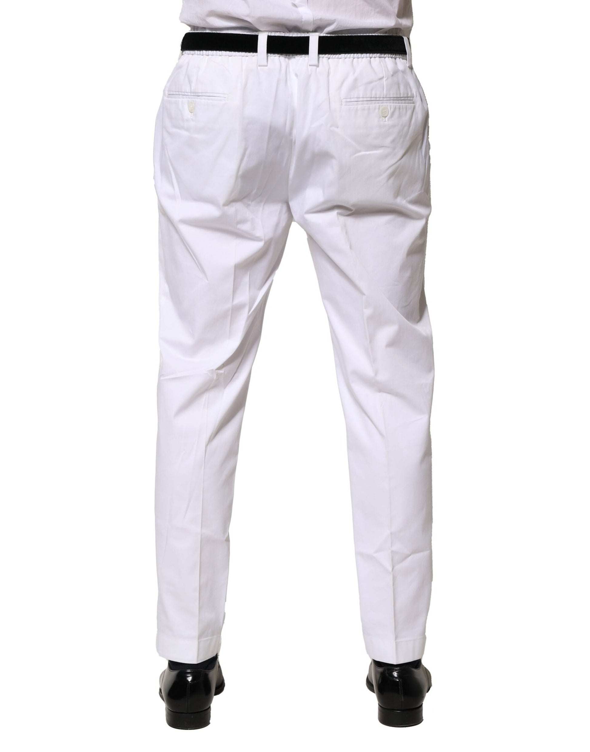 A pair of white cotton dress pants from Dolce & Gabbana, featuring a slim fit and formal design