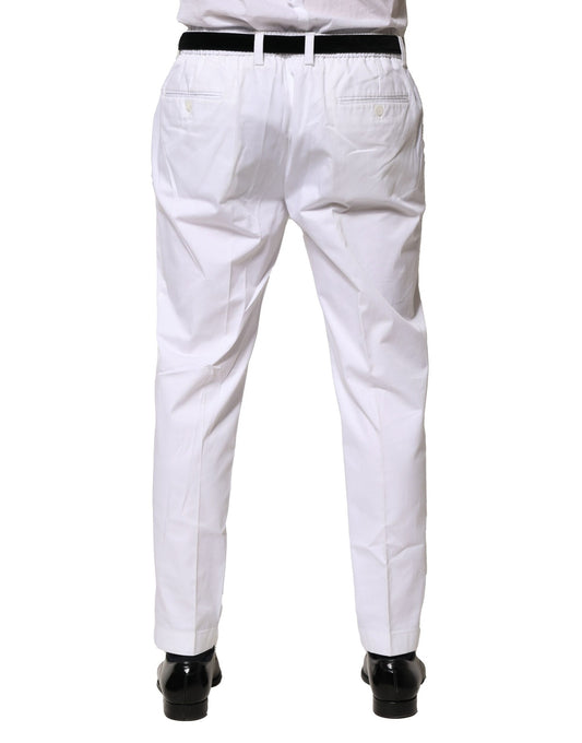 A pair of white cotton dress pants from Dolce & Gabbana, featuring a slim fit and formal design