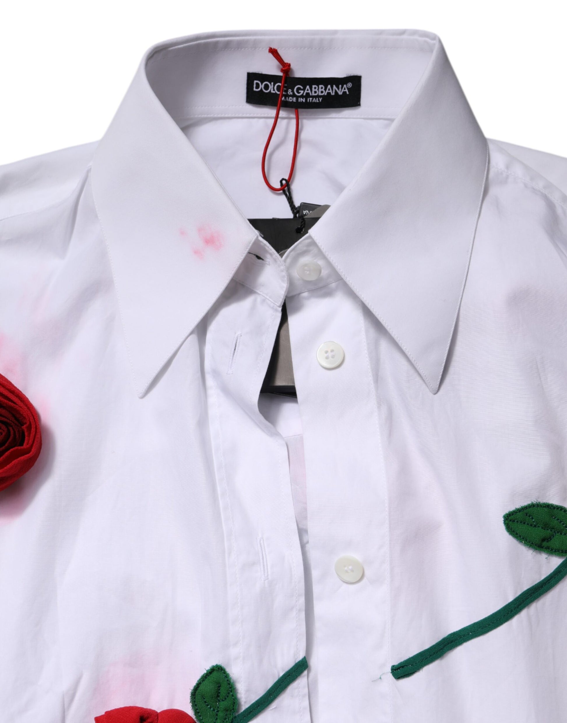 A white cotton dress shirt with floral appliques and a red rose embroidery