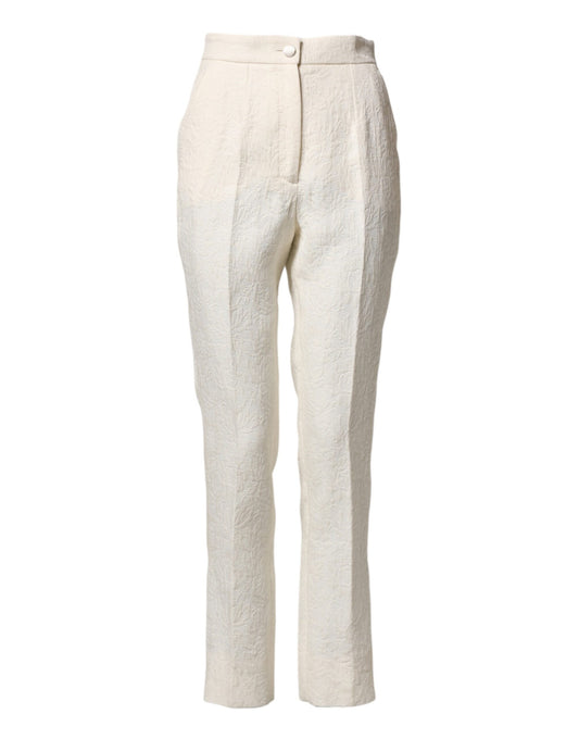 A pair of white cotton floral brocade dress pants by Dolce & Gabbana