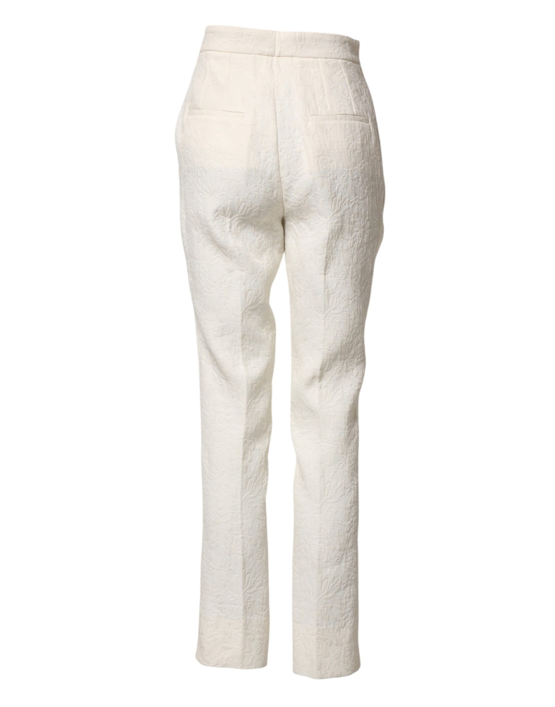A pair of white cotton floral brocade dress pants by Dolce & Gabbana