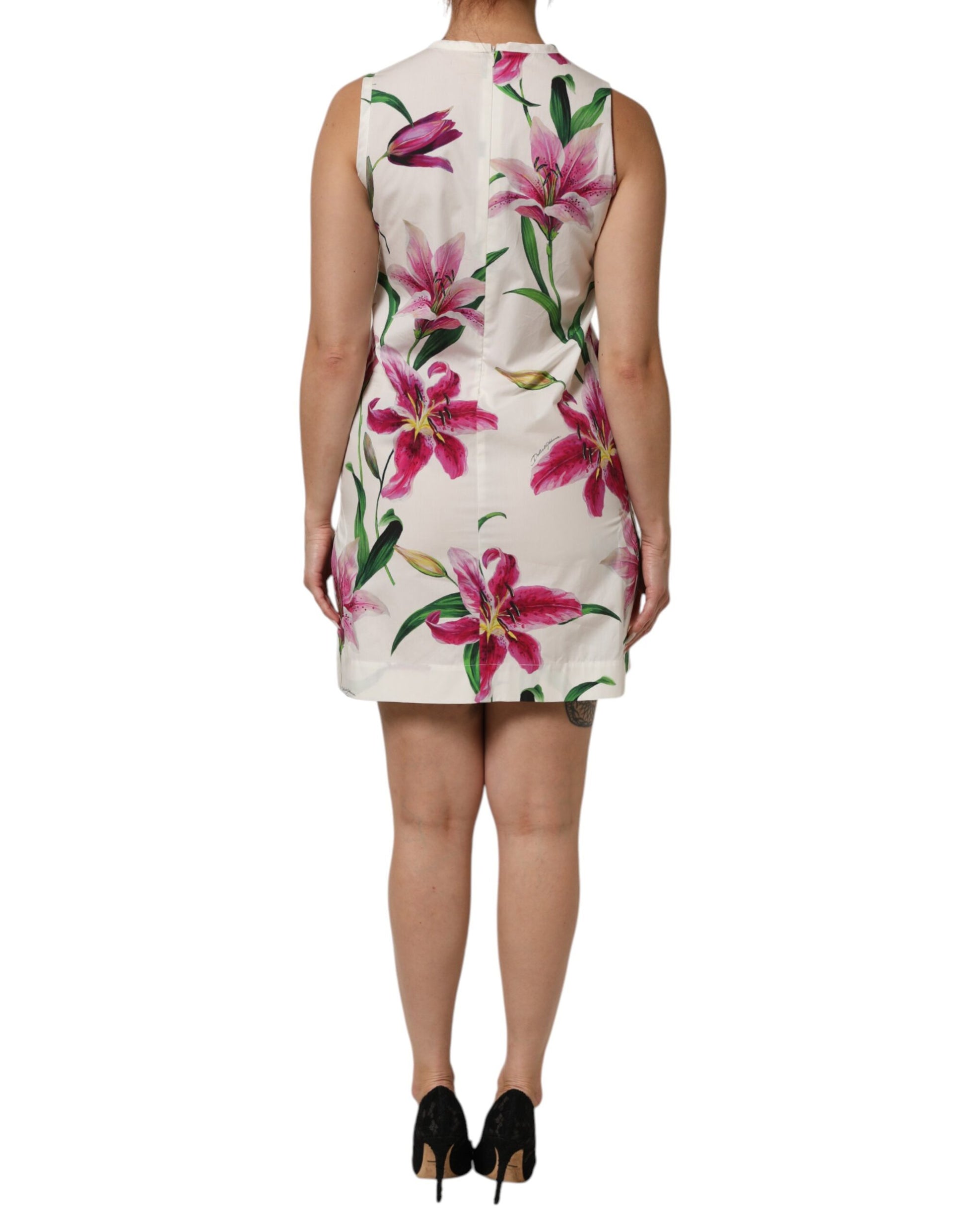 A sleeveless, knee-length dress with a floral print on the front