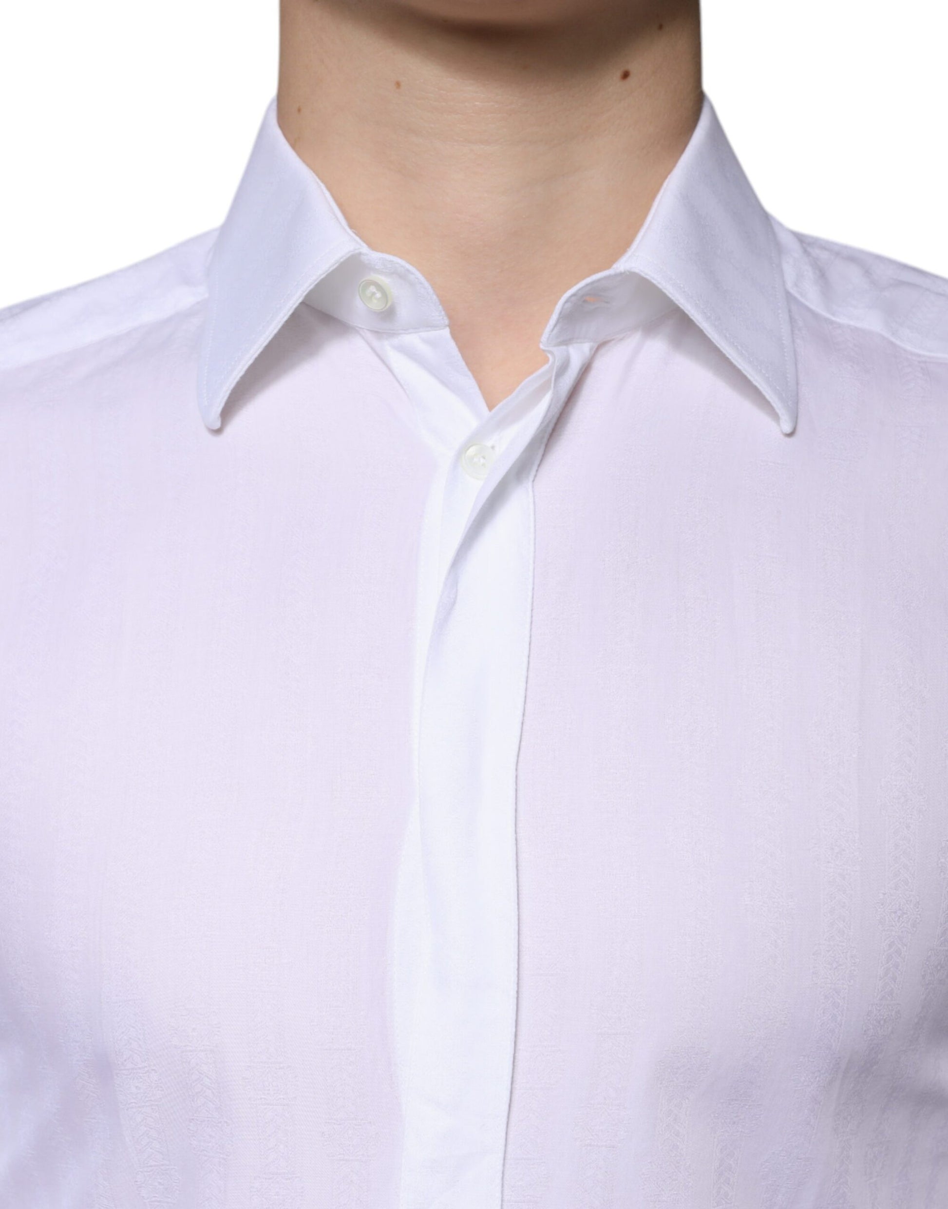 A white cotton dress shirt with a collar and buttons, designed for formal wear