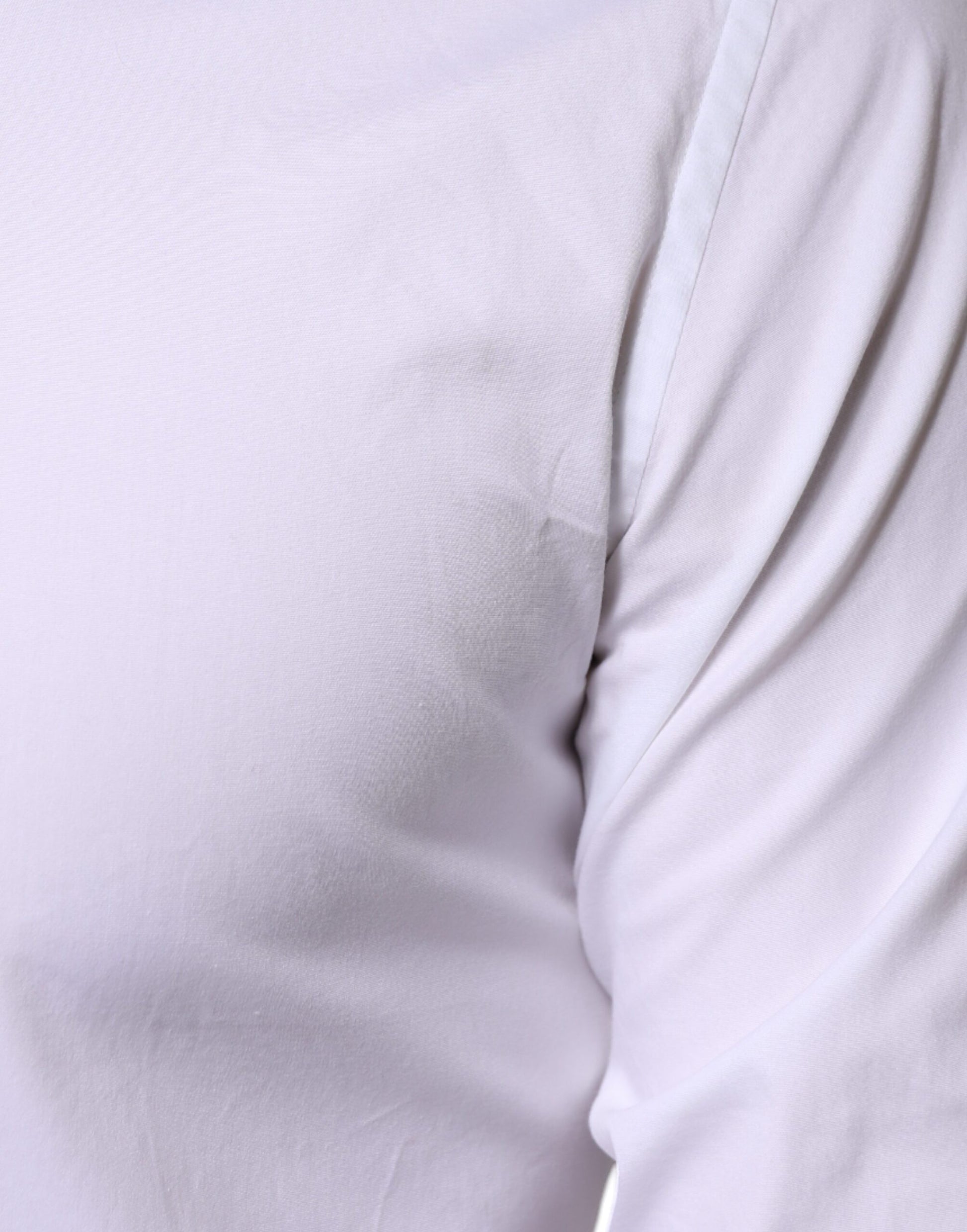 A white cotton formal men's dress shirt with a gold design on the sleeve