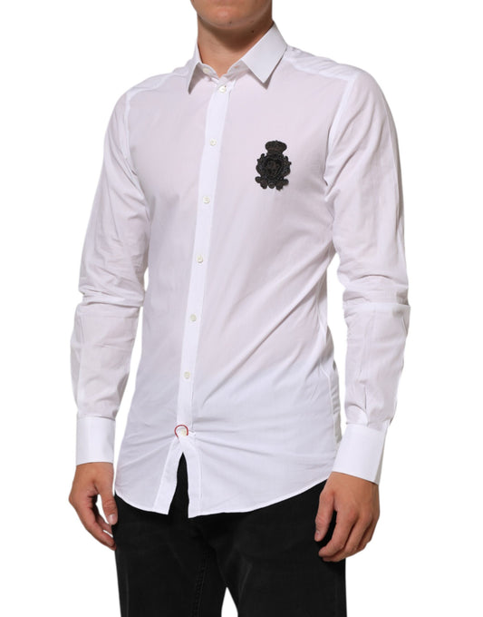 A white cotton dress shirt with a gold patch on the left chest