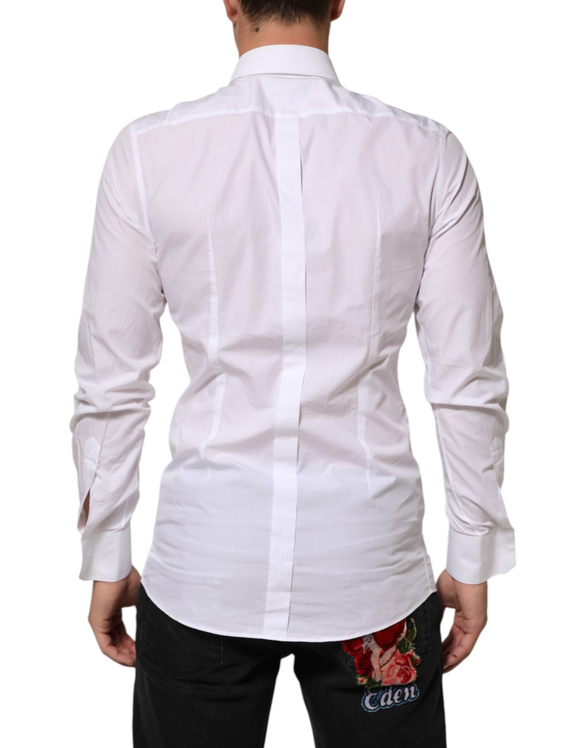 A white cotton dress shirt with a gold patch on the left chest