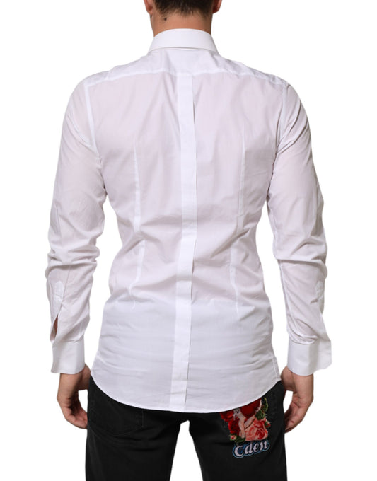 A white cotton dress shirt with a gold patch on the left chest