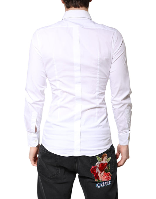 A white cotton collared shirt with gold detailing, featuring a floral embroidered patch on the back