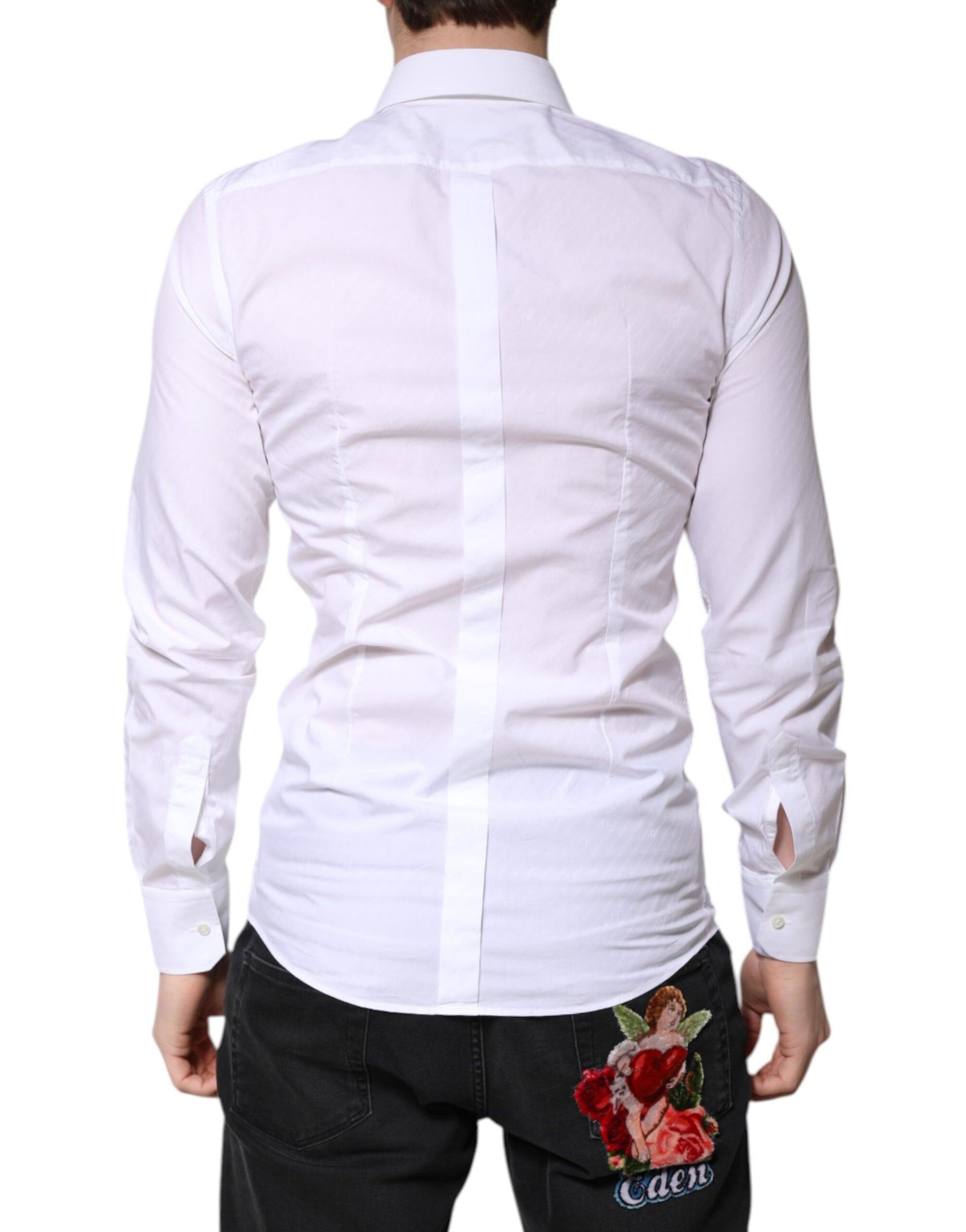 A white cotton dress shirt with a collar and gold accents, worn by a mannequin