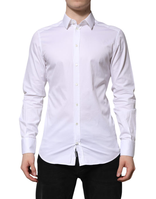 A long sleeved white cotton dress shirt with gold accents from the brand Dolce & Gabbana