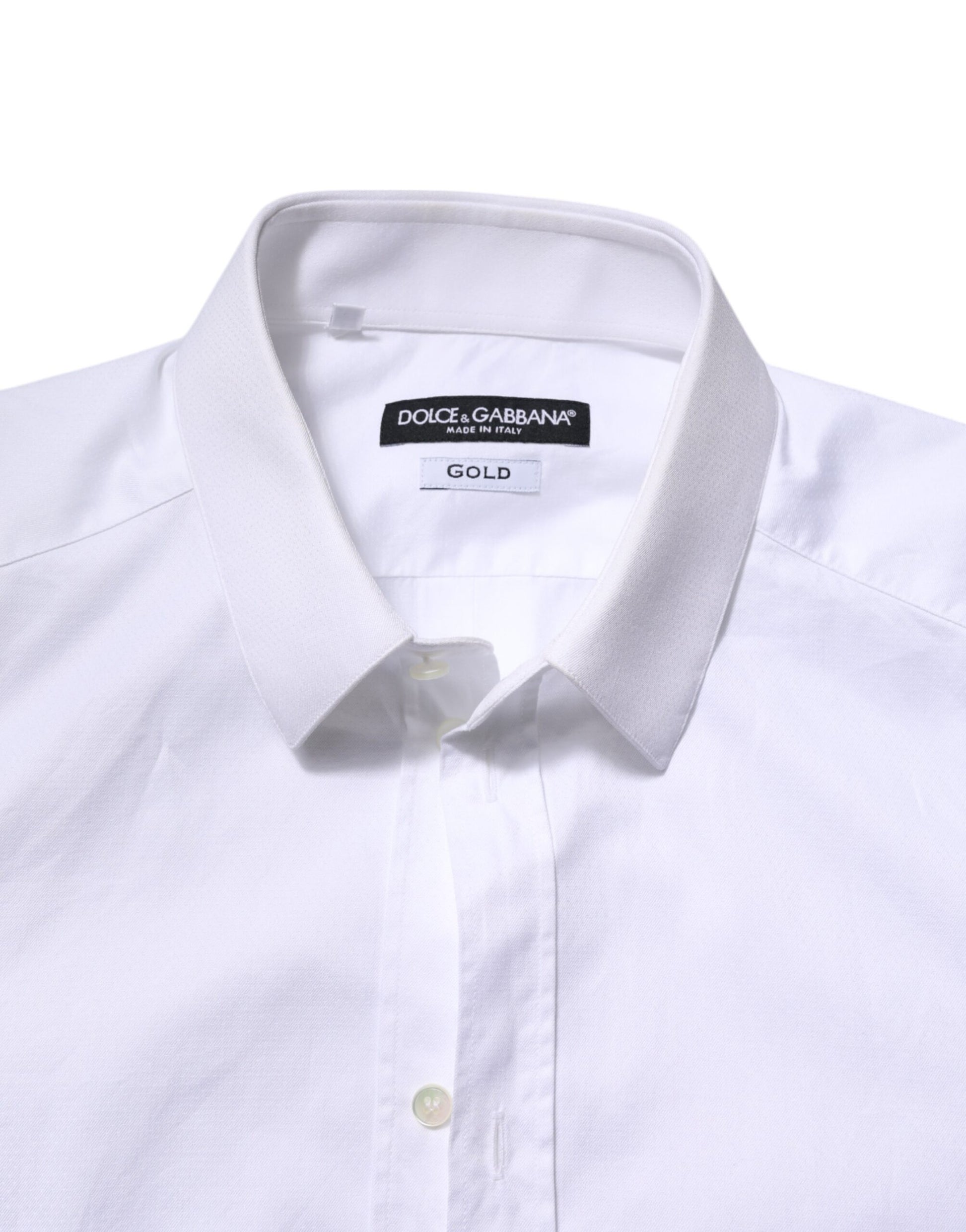A white cotton dress shirt with long sleeves, featuring a gold label on the collar