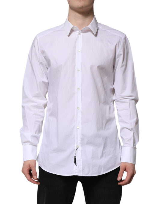 A long sleeve white cotton dress shirt with a gold collar and cuffs