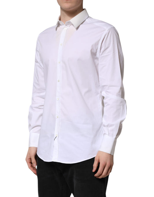 A long sleeve white cotton dress shirt with a gold collar and cuffs