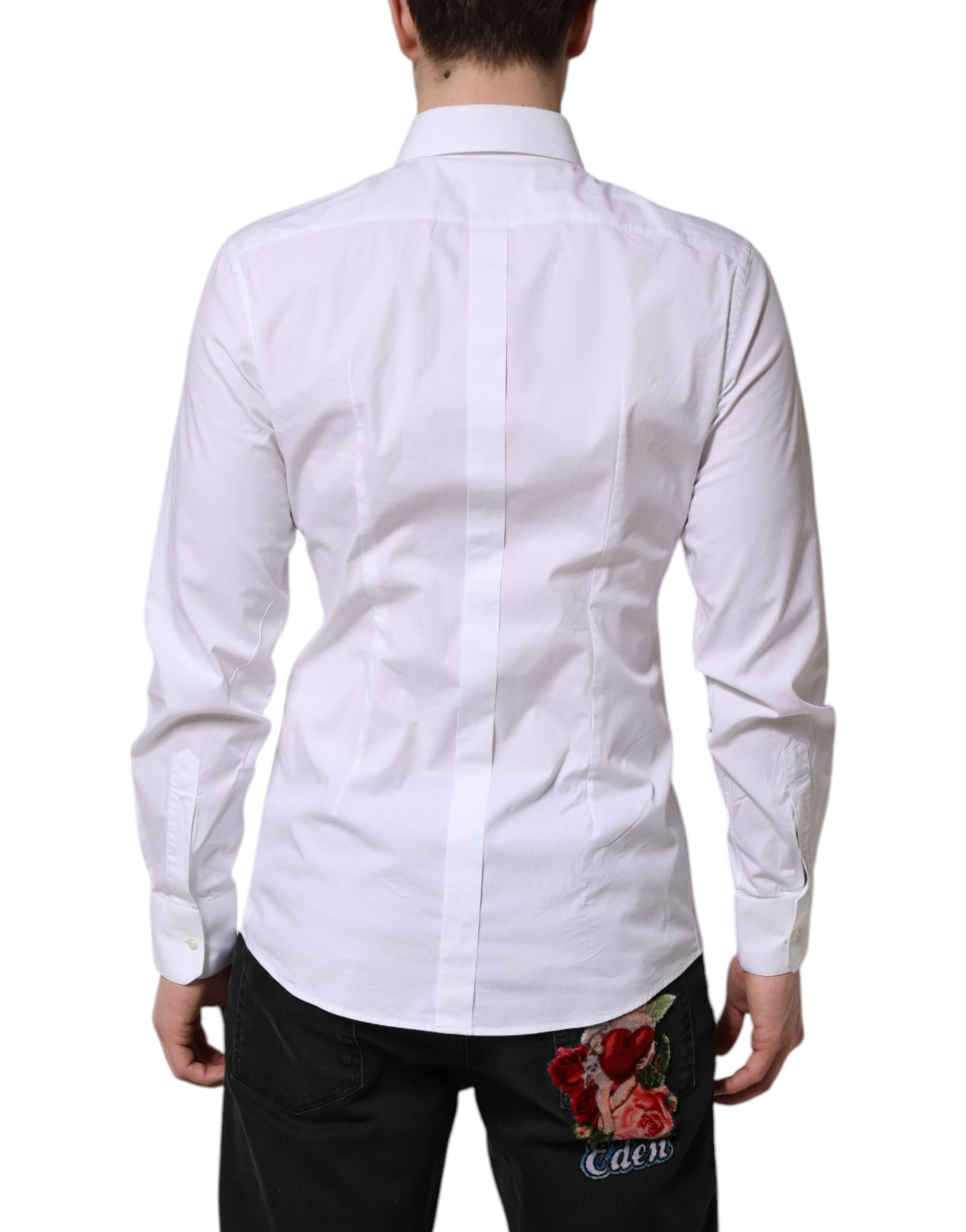 A white cotton dress shirt with long sleeves, featuring a gold design and a rose embroidered on the back