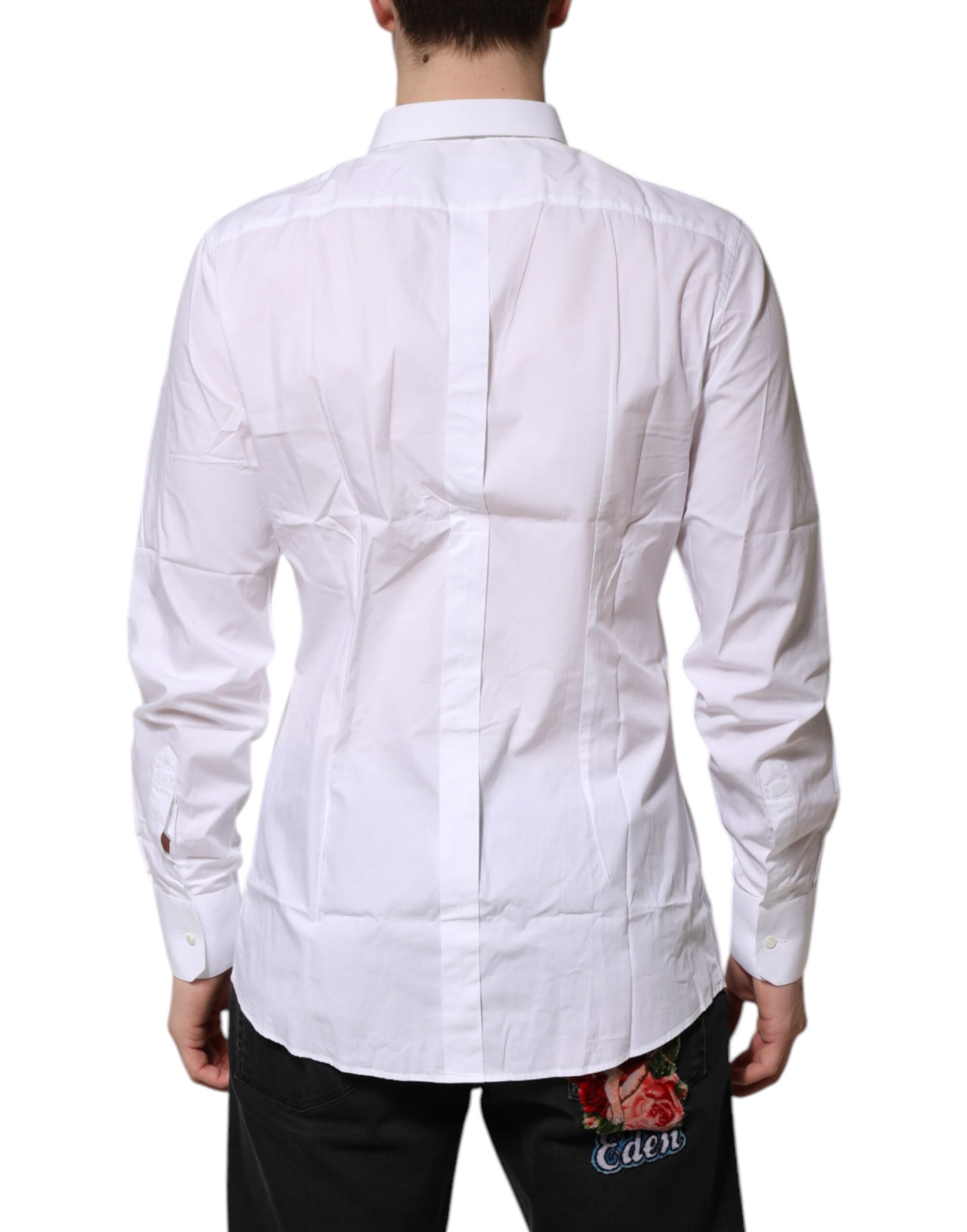A long sleeve white cotton dress shirt with gold accents, featuring a lapel collar and a back pocket