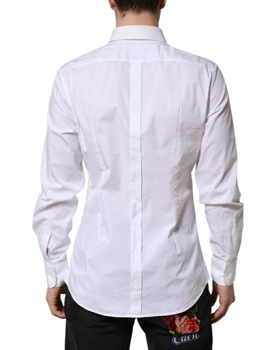 A long sleeve white cotton dress shirt with gold accents from the brand Dolce & Gabbana