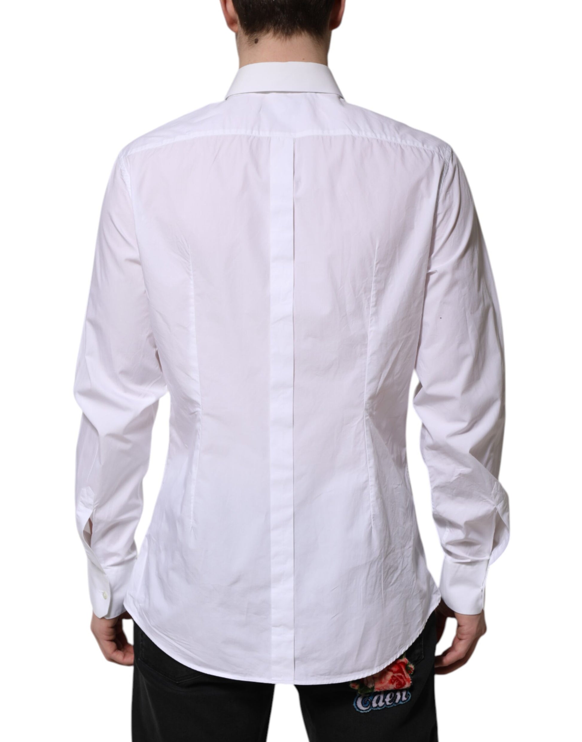 A long sleeve white cotton dress shirt with a gold design on the back