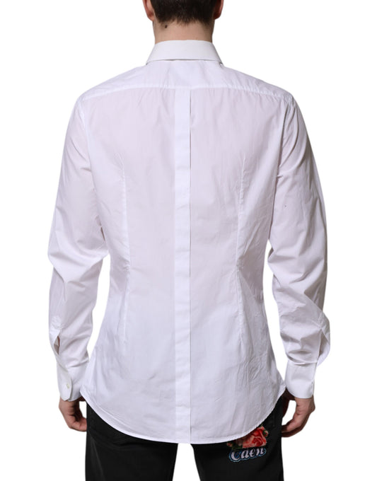 A long sleeve white cotton dress shirt with a gold design on the back