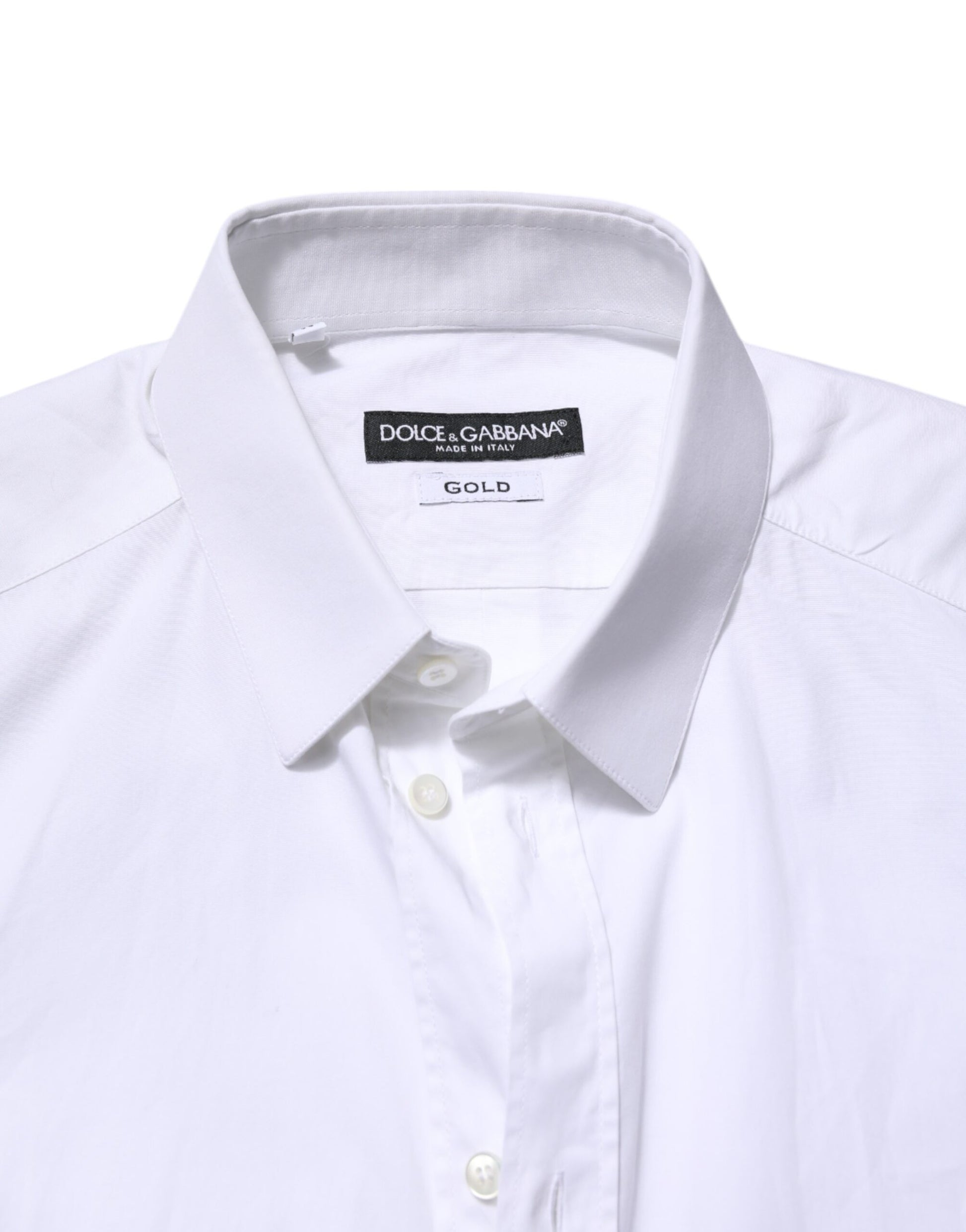 A white cotton dress shirt with long sleeves and a gold label on the collar