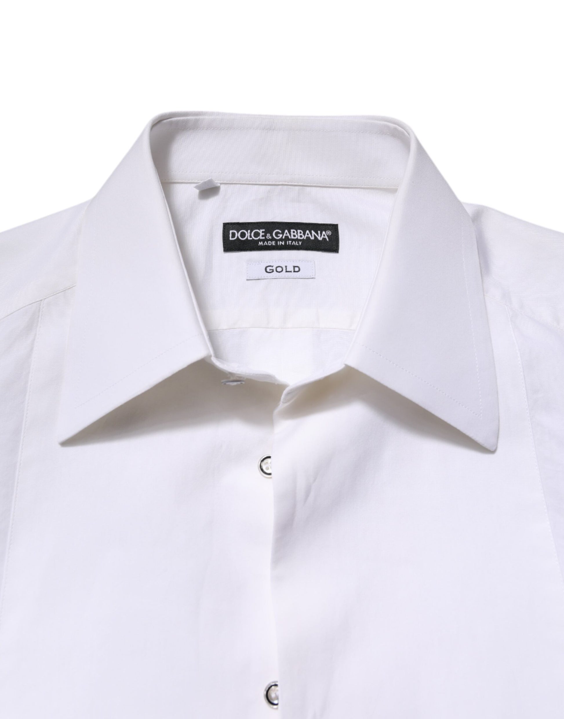 A white cotton dress shirt with long sleeves and a gold label on the collar