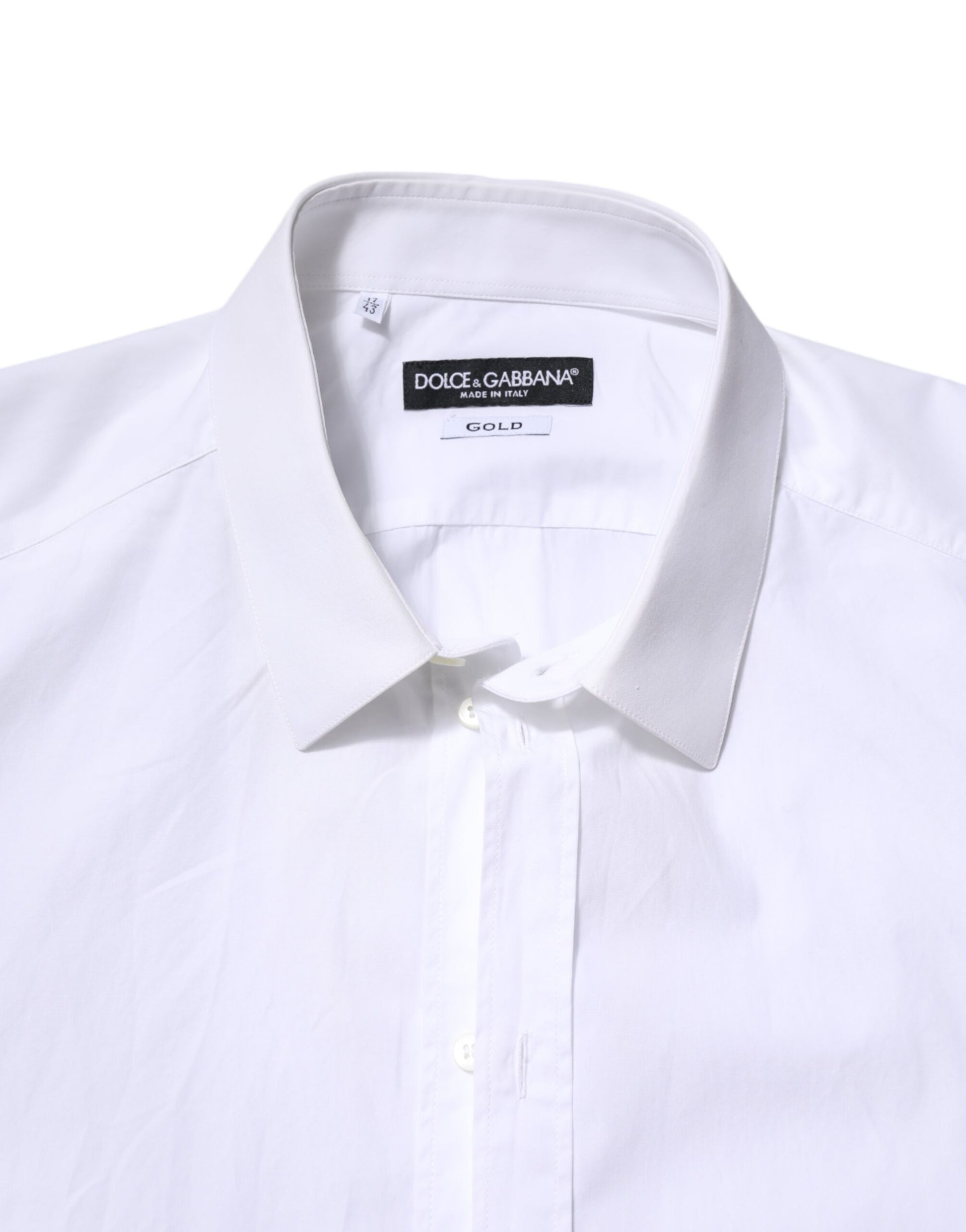 A white cotton dress shirt with long sleeves and gold accents from the brand Dolce & Gabbana