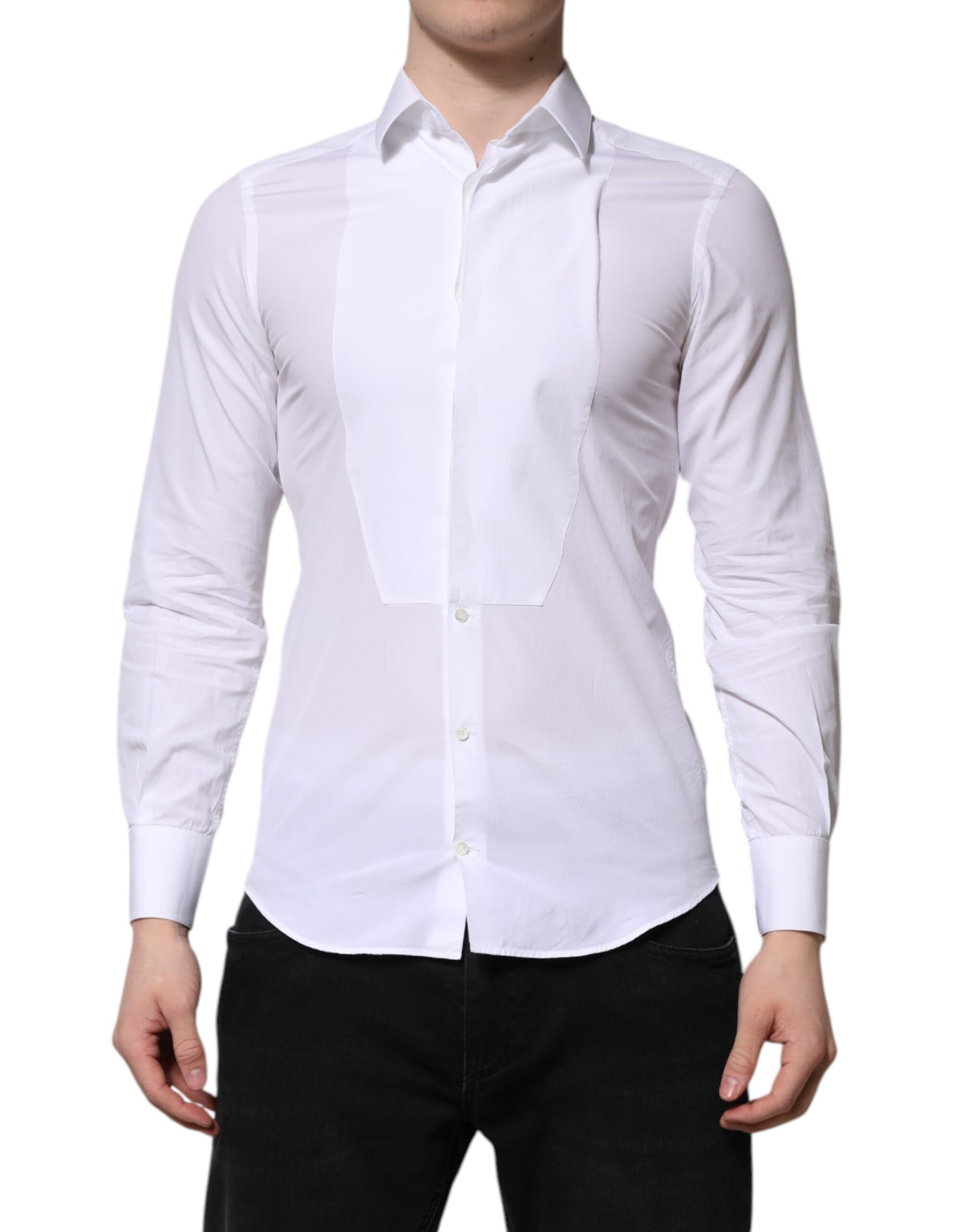 A white cotton dress shirt with long sleeves, designed by Dolce & Gabbana. It features a gold pattern on the