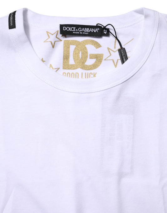 White t-shirt with gold lettering and stars