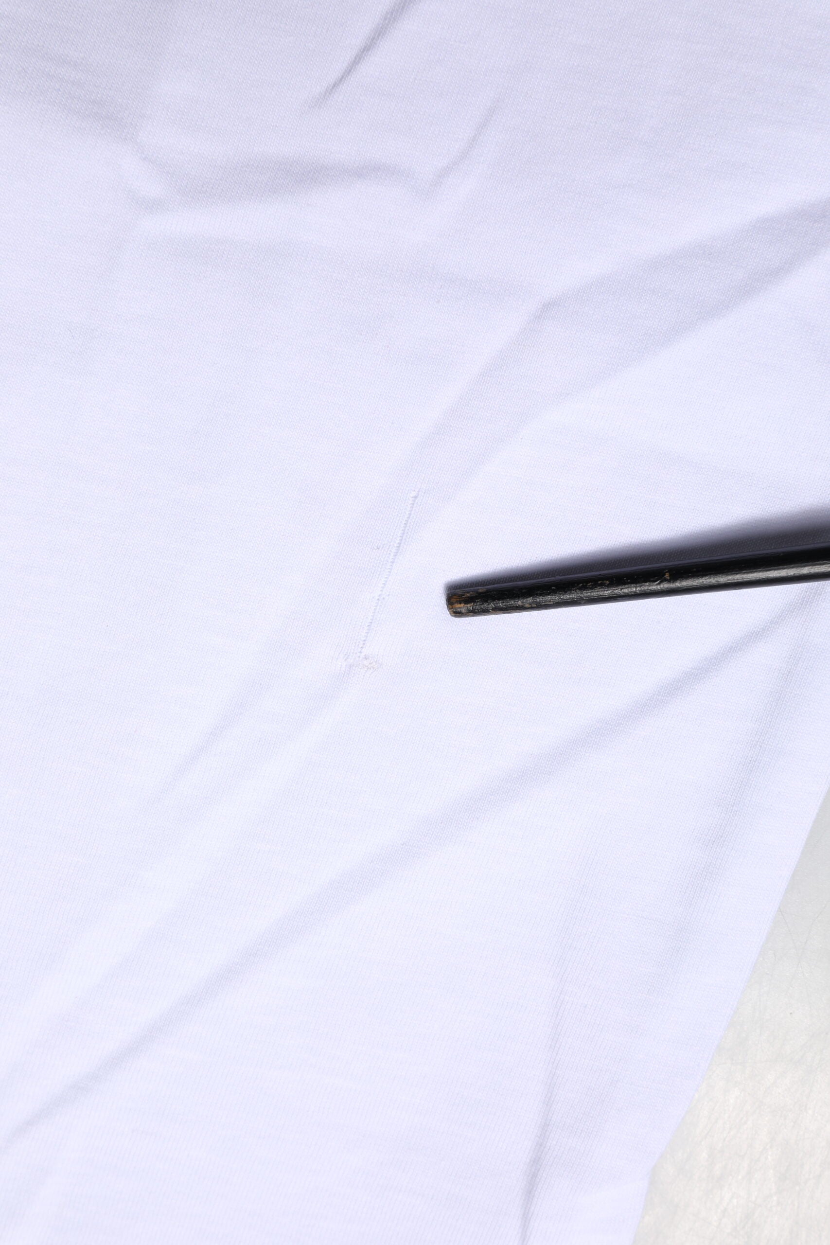 Black zipper on white fabric