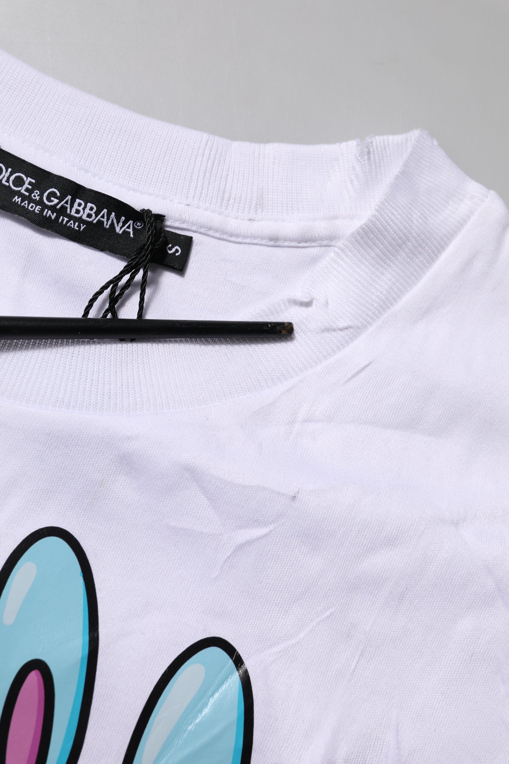 White t-shirt with graphic design on front