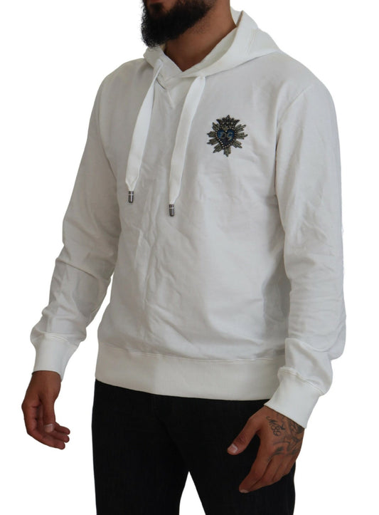 Man wearing white hoodie with emblem on front