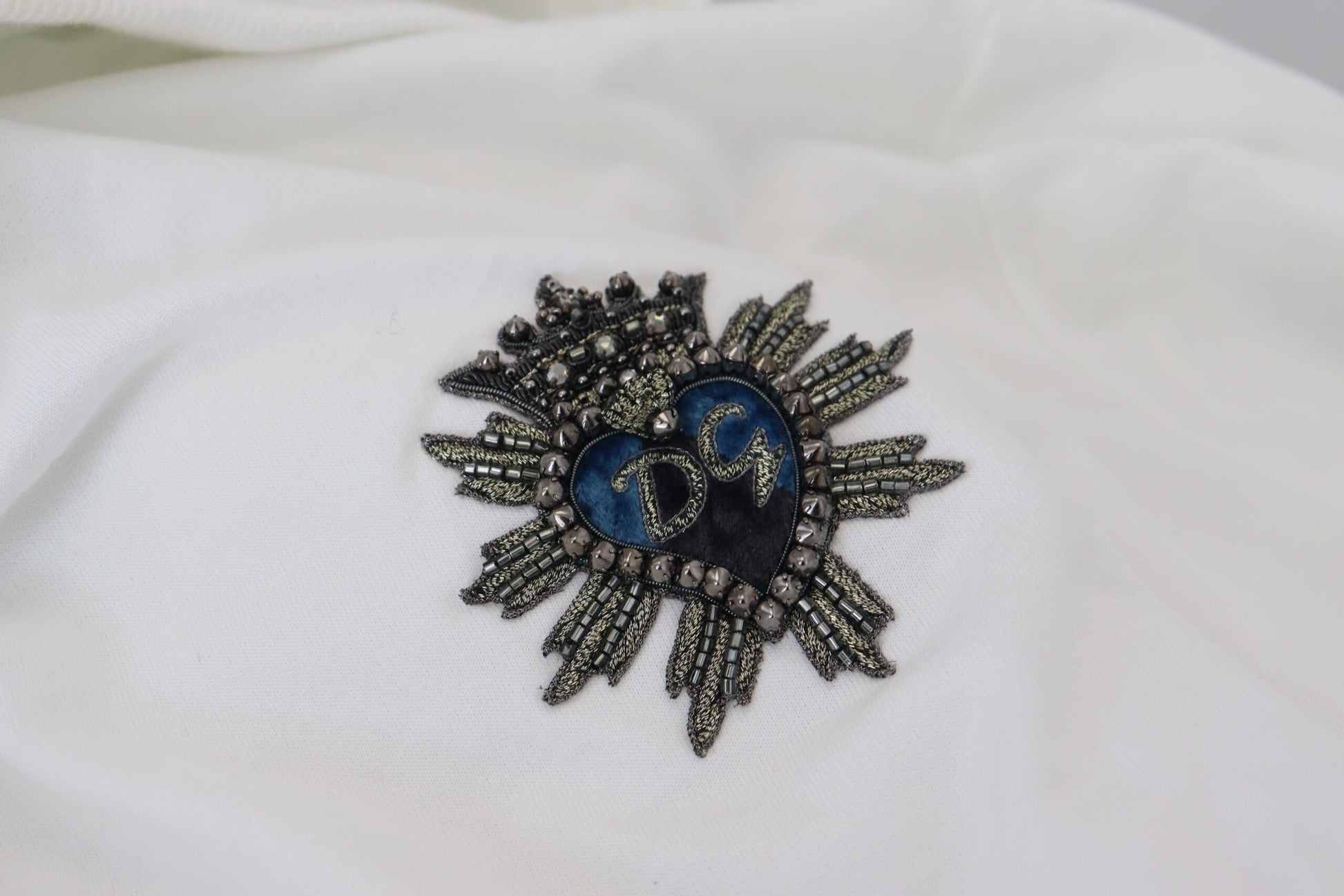 Embellished sun design on fabric