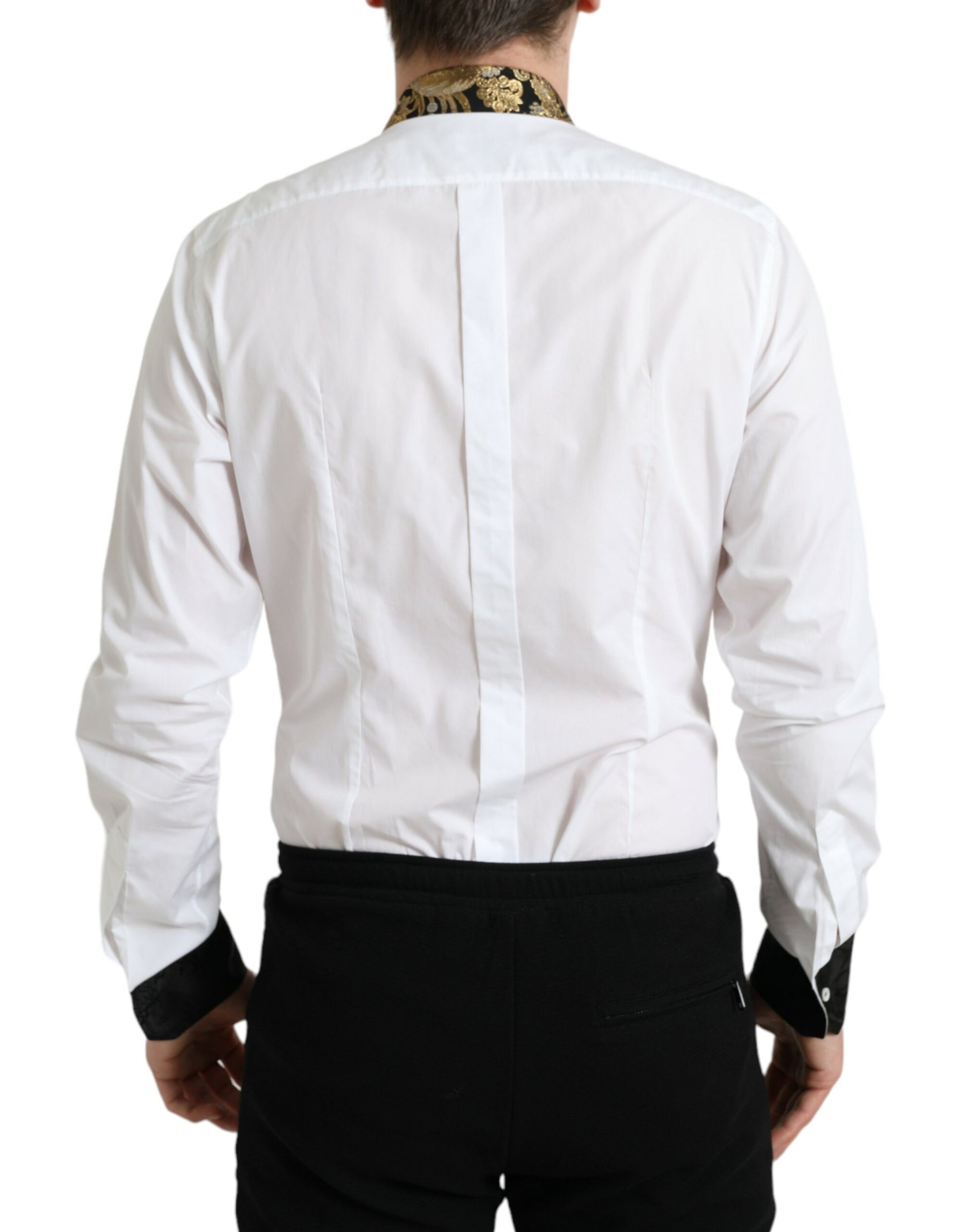 Man wearing white shirt with black collar and sleeves