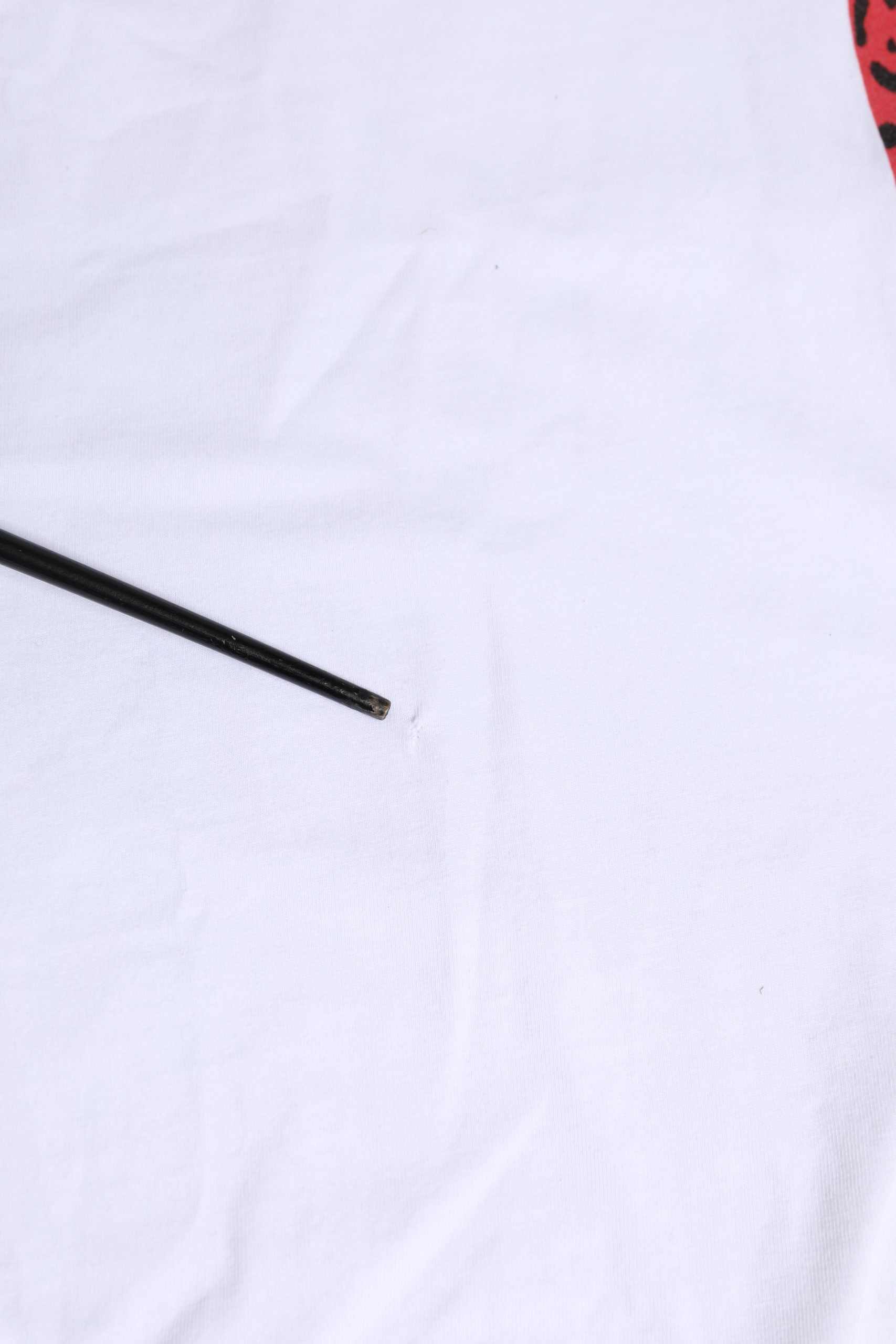 Black pen on white fabric
