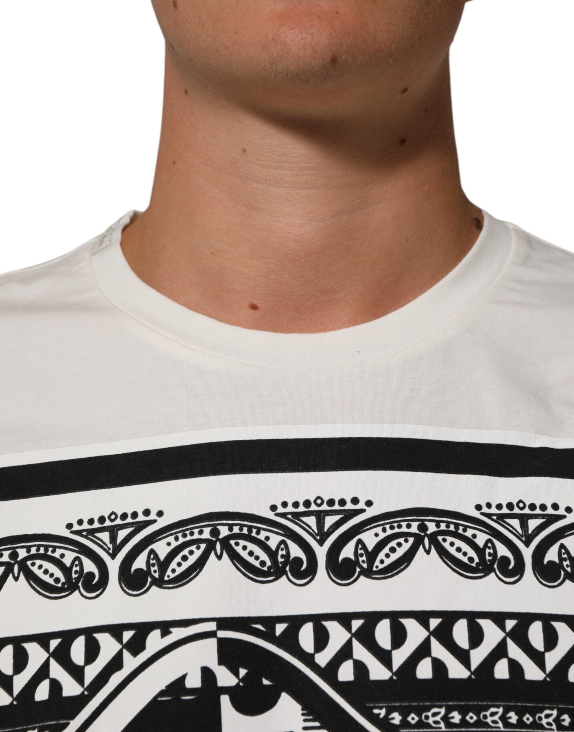 Man wearing white t-shirt with black design on front
