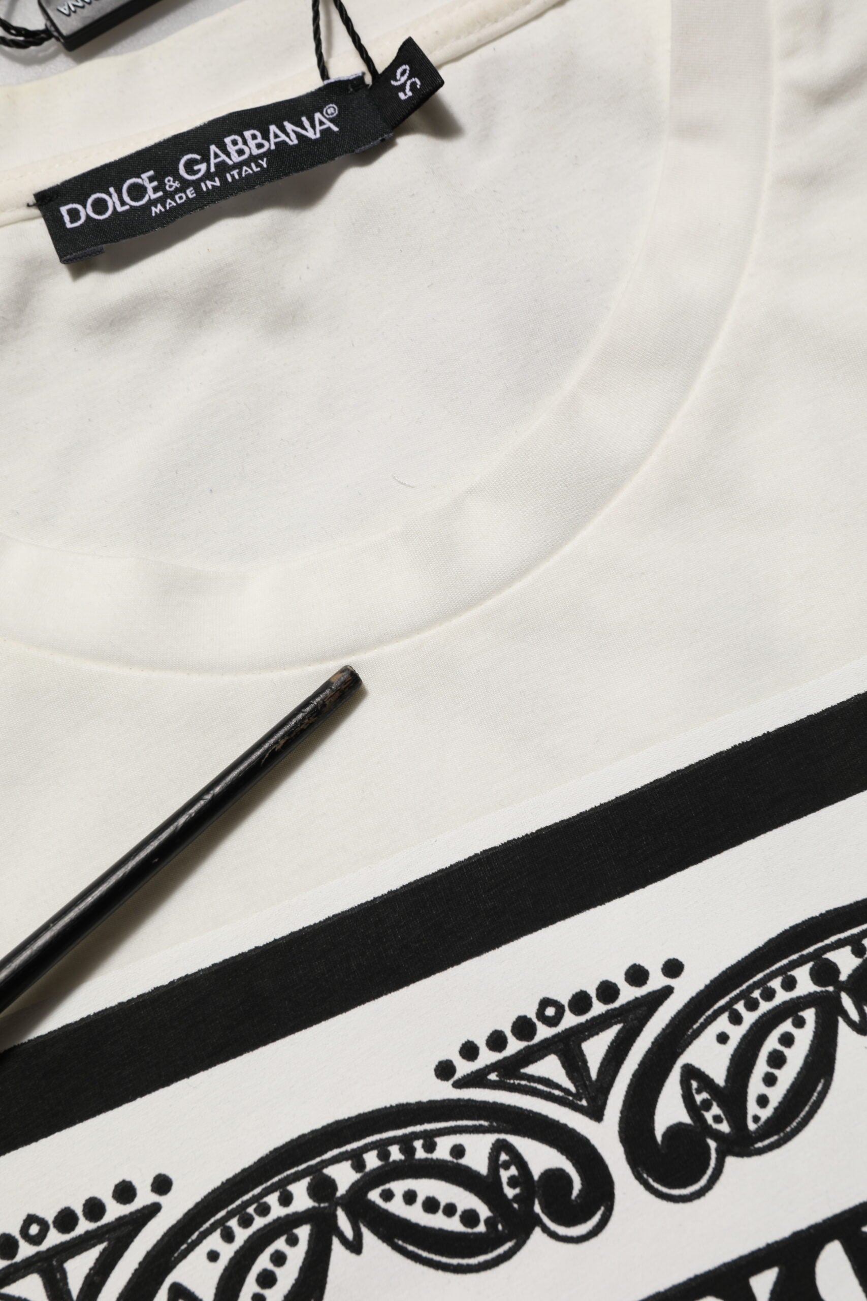 White t-shirt with black design on front
