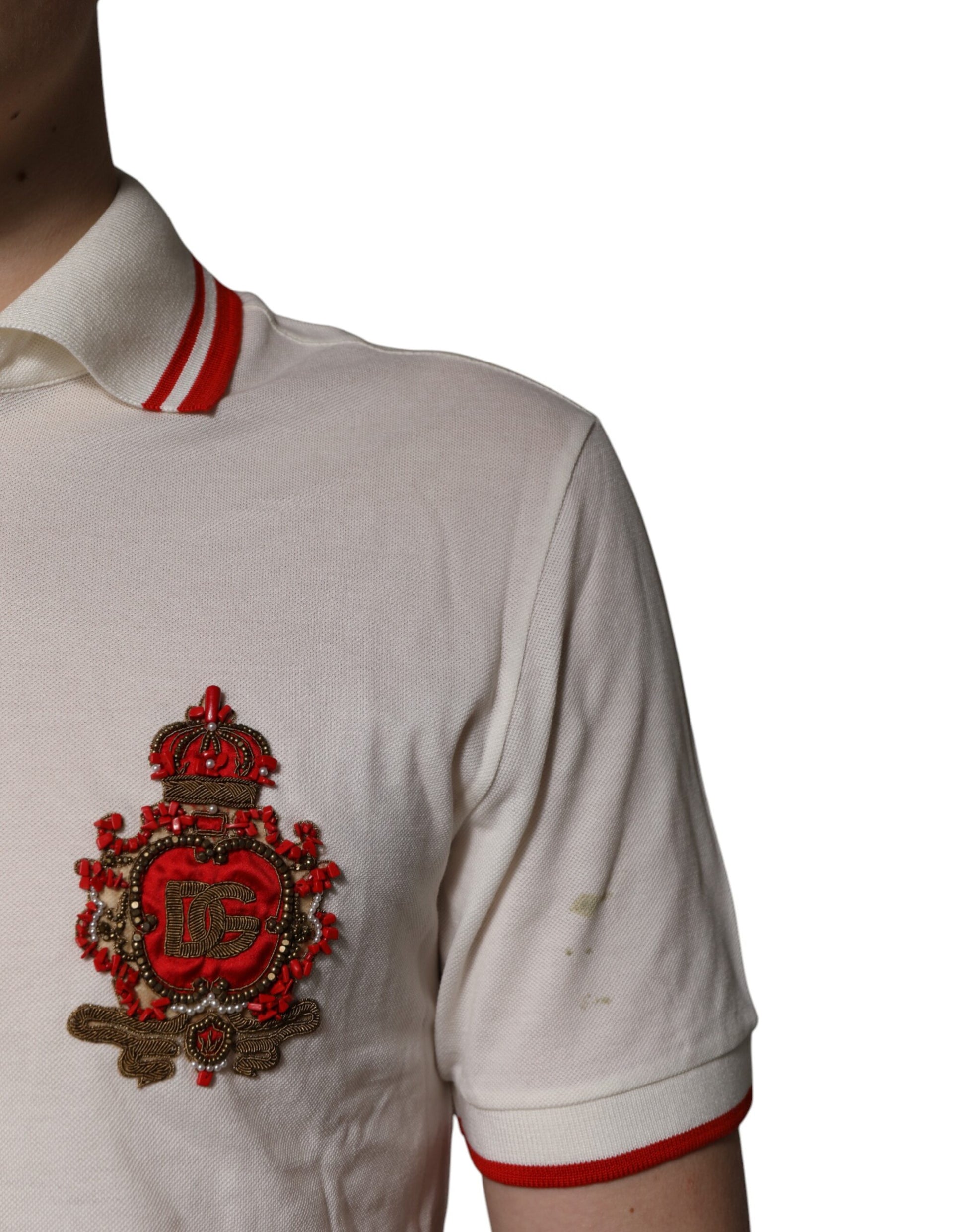 White polo shirt with red stripes and embroidered emblem on left chest