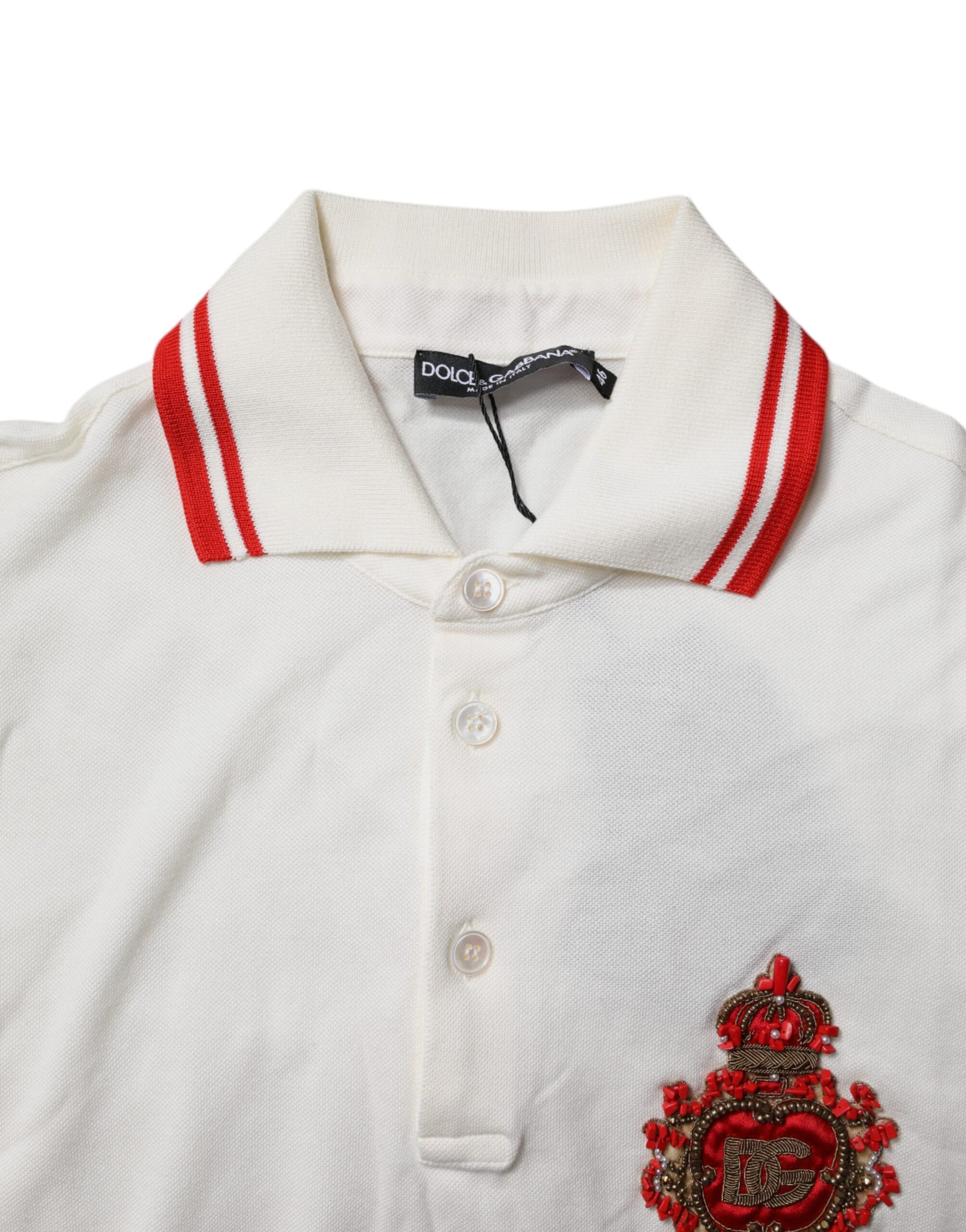 White polo shirt with red stripe, embroidered emblem on left chest, buttoned front, short sleeves